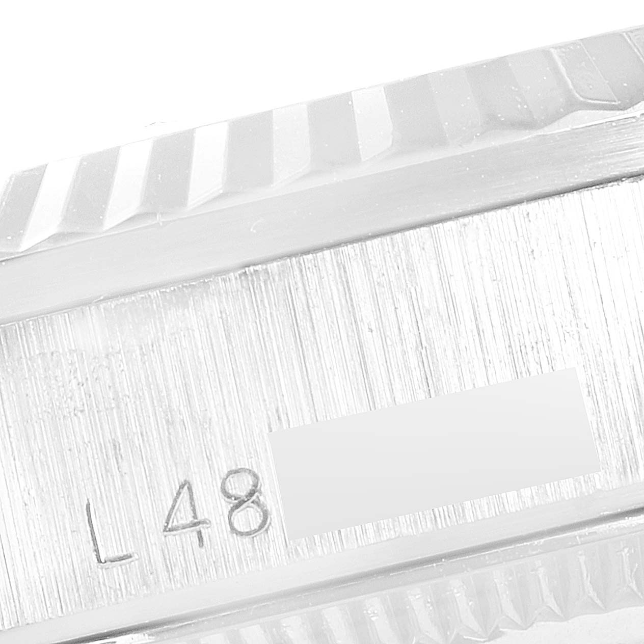 This is a close-up of the side bezel and serial number of the Rolex President 68279 Women's White Gold Silver Dial 68279 Women's White Gold Silver Dial model watch.