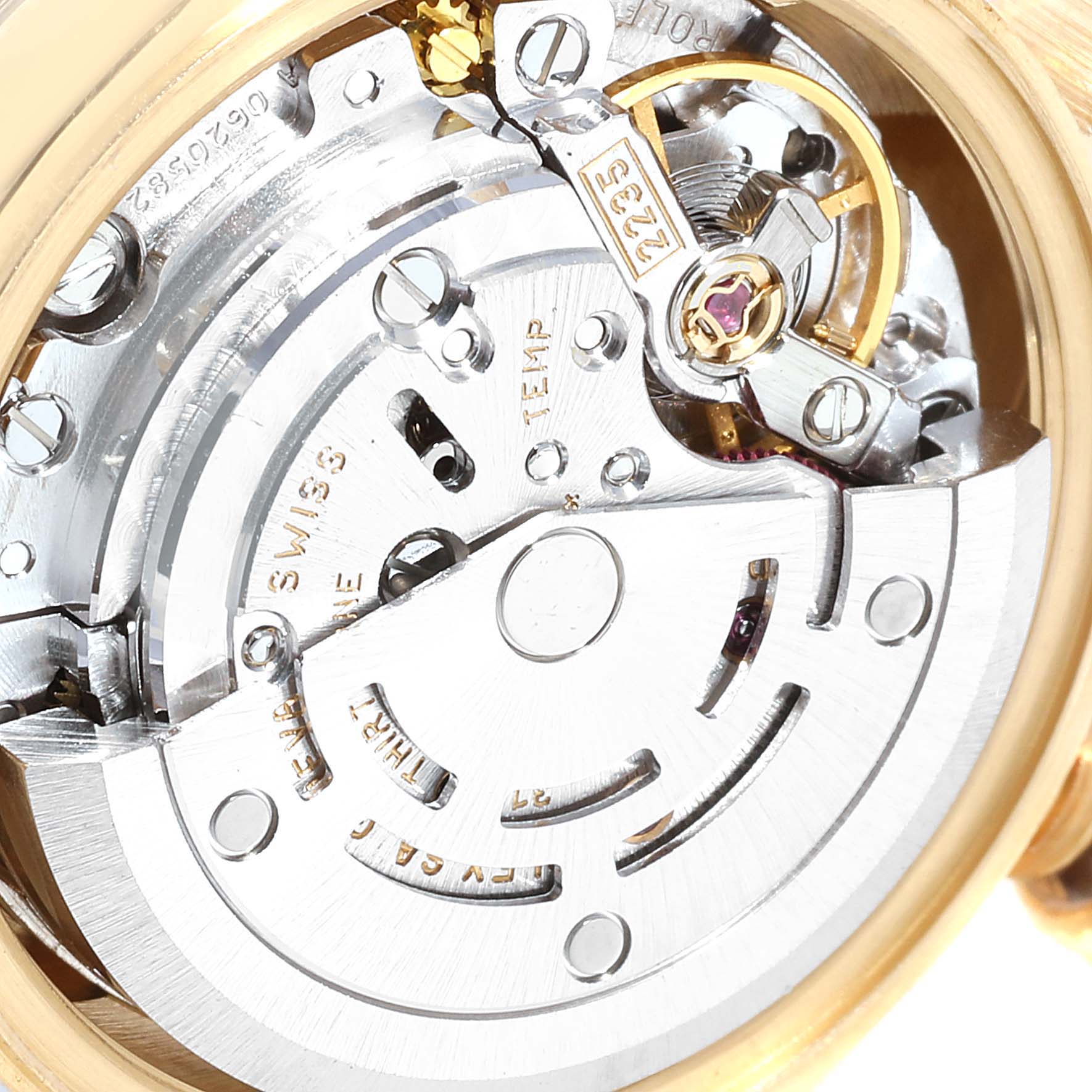 The image shows a close-up of the movement and inner workings of a Rolex President 79258 Women's Yellow Gold Beige Dial 79258 Women's Yellow Gold Beige Dial model watch.