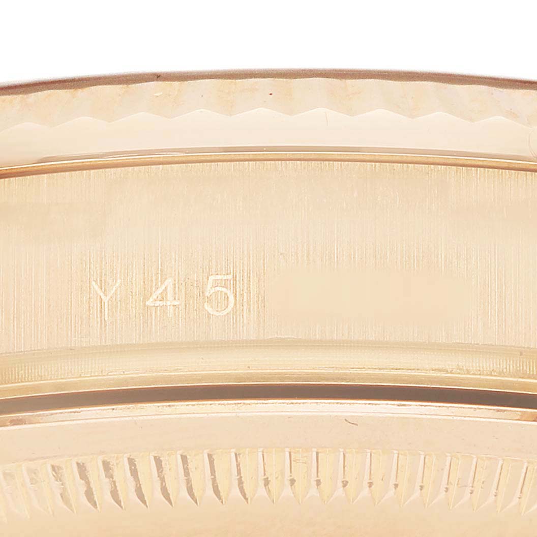 The image shows a close-up of the side of a Rolex President 118235 Men's Rose Gold Pink Dial model, highlighting the case edge and reference number.