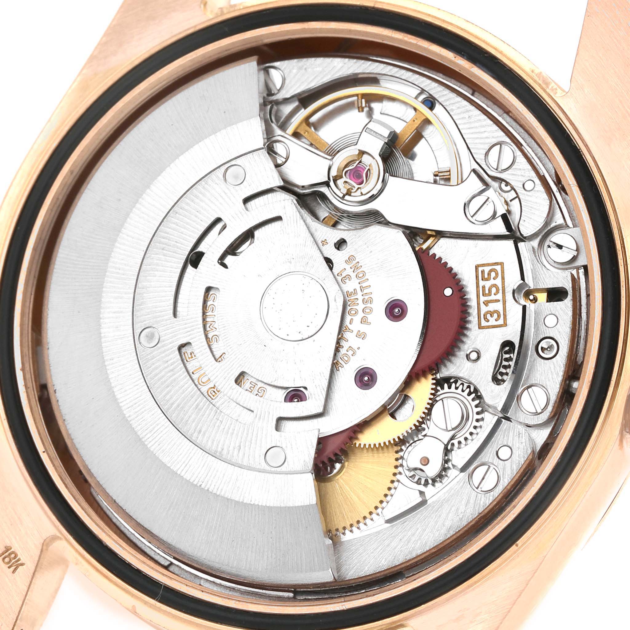 The image shows the back view of a Rolex President 118235 Men's Rose Gold Pink Dial model watch, revealing its movement and internal mechanics.