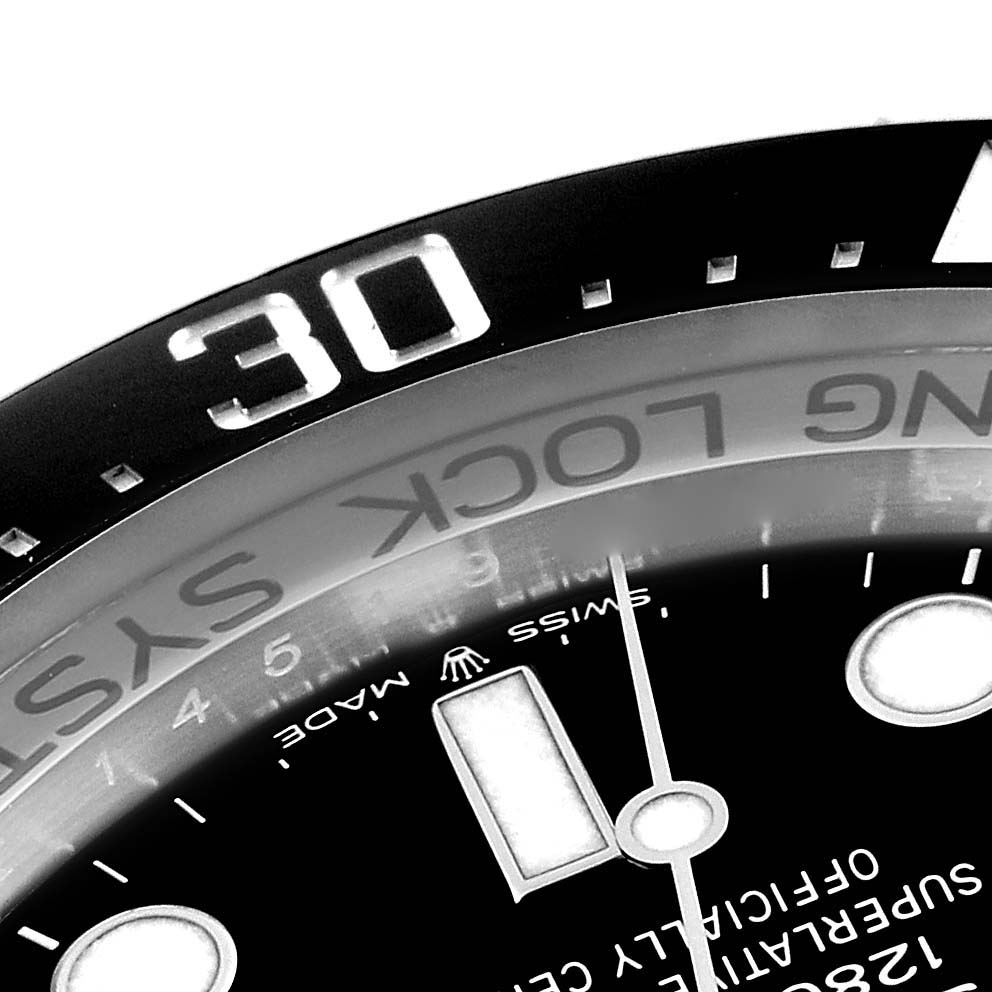 This image shows a close-up view of the dial and bezel of a Rolex Sea-Dweller 126660 Men's Stainless Steel Black Dial 126660 Men's Stainless Steel Black Dial watch.