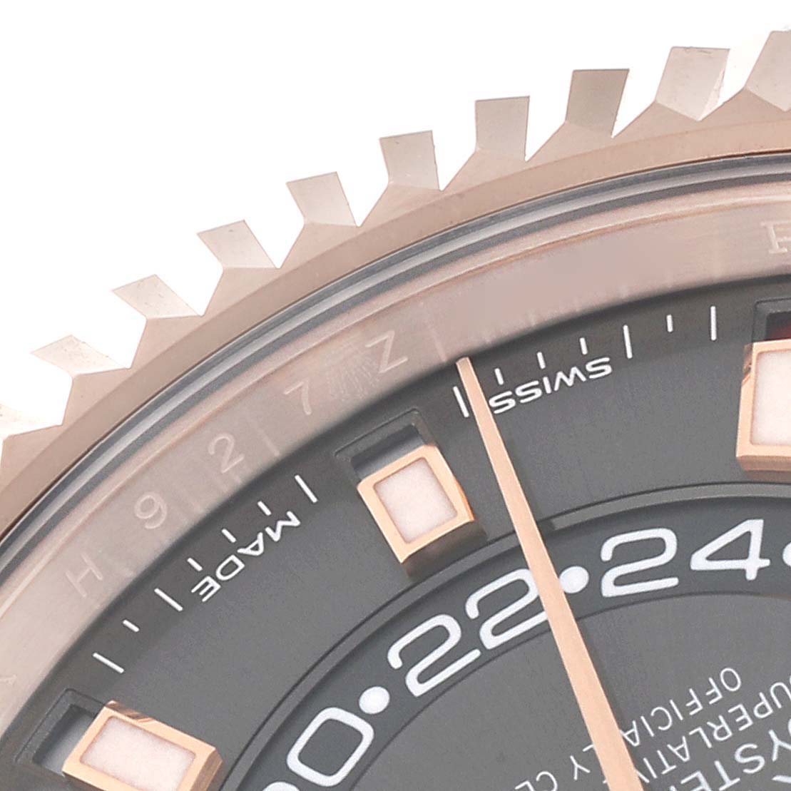 The image shows a close-up of the bezel and dial details on a Rolex Sky-Dweller 326135 Men's Rose Gold Grey Dial 326135 Men's Rose Gold Grey Dial watch.