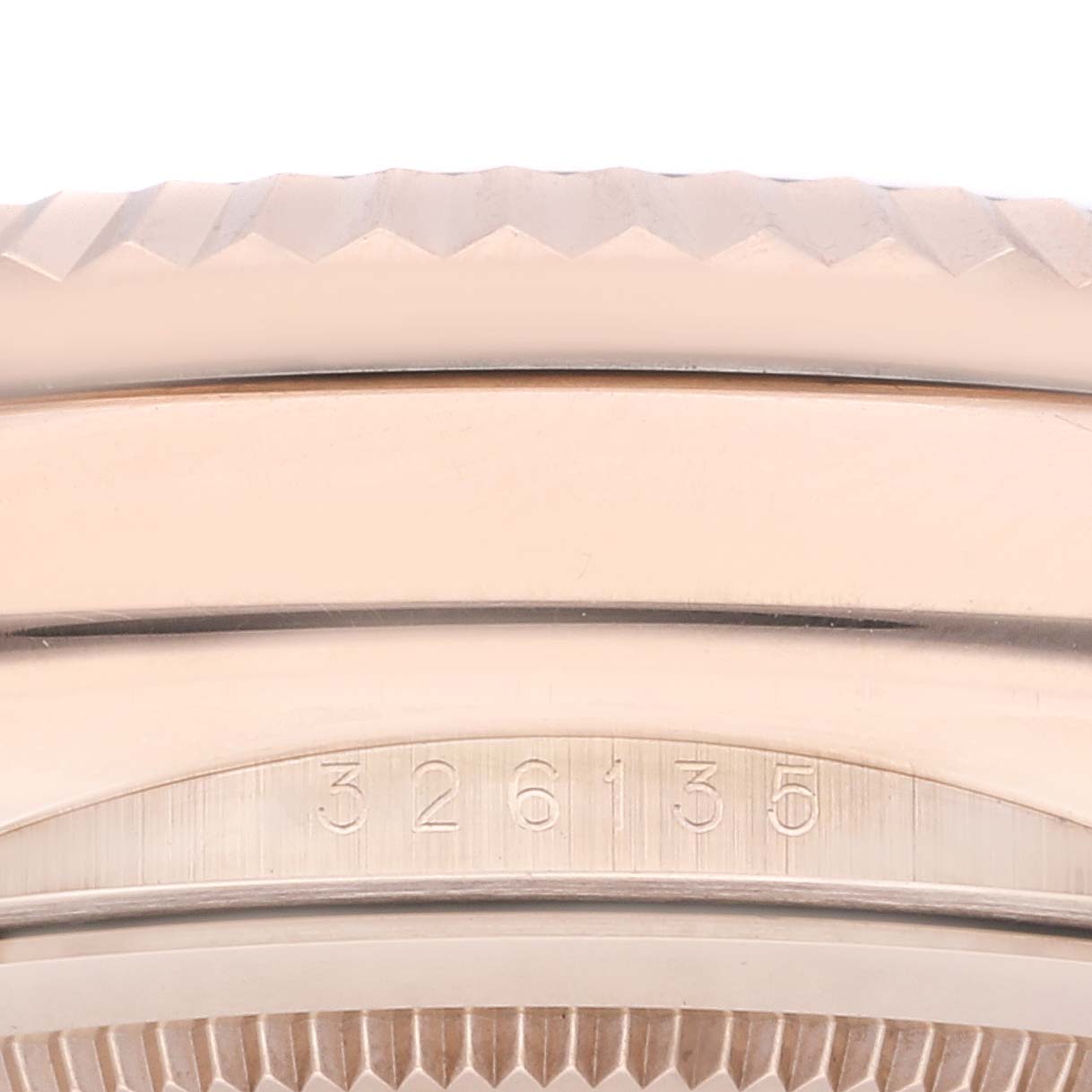 Close-up of the bezel and serial number on a Rolex Sky-Dweller 326135 Men's Rose Gold Grey Dial 326135 Men's Rose Gold Grey Dial watch, showing its intricate detailing.