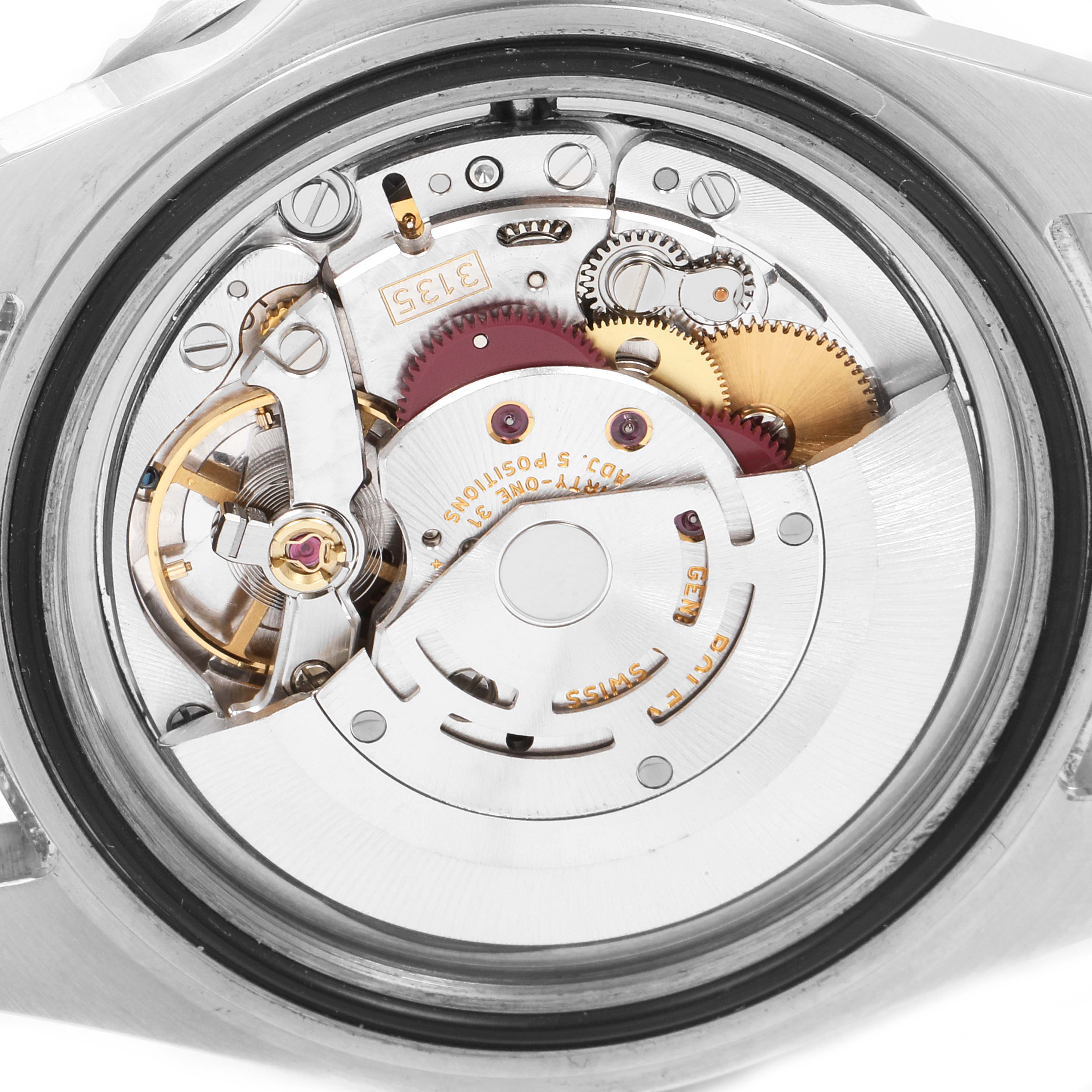 This image shows the internal mechanism of a Rolex Submariner 16610 Men
s Stainless Steel Black Dial 16610 Men
s Stainless Steel Black Dial watch, specifically the movement and gears.