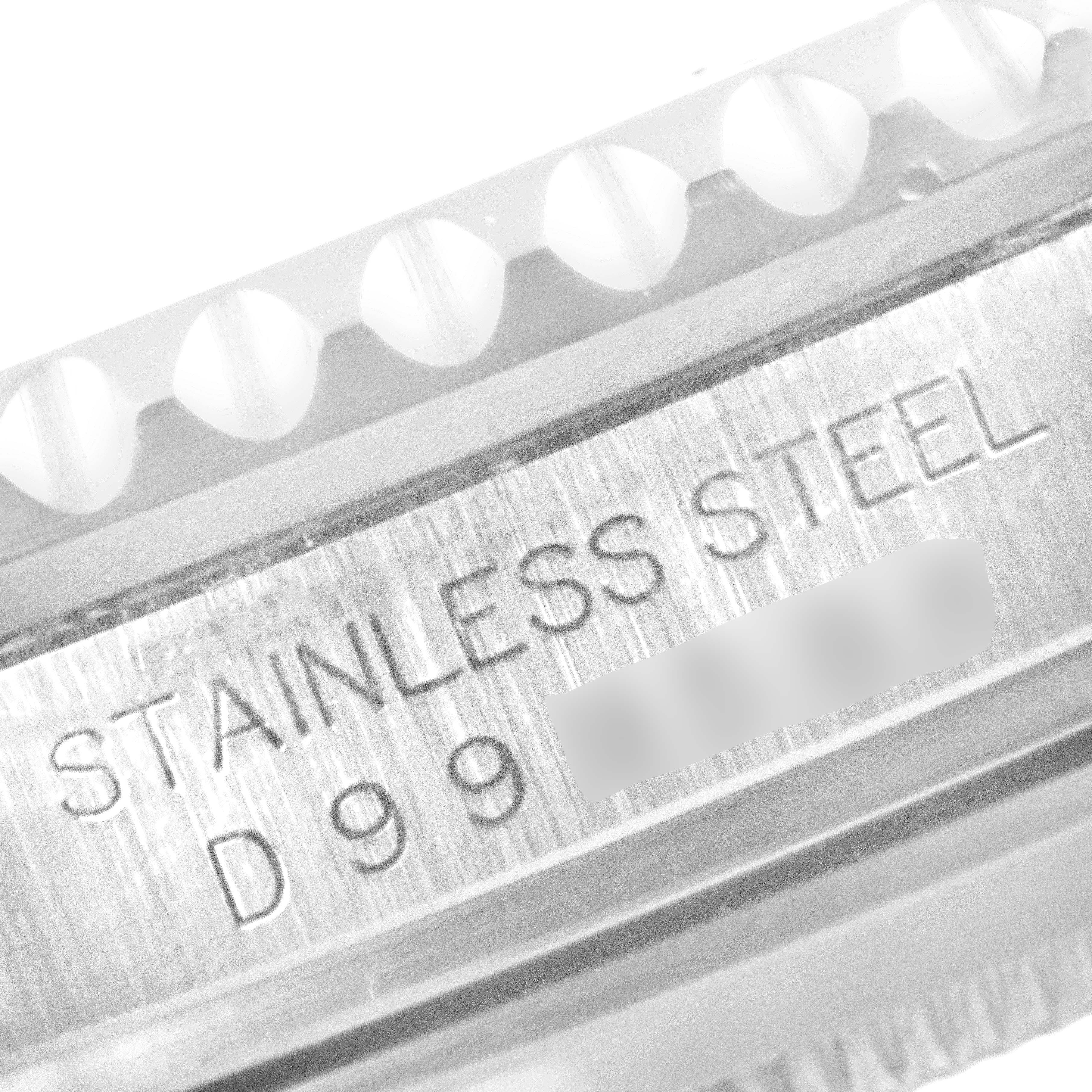 This close-up image showcases the stainless steel engraved casing with a partial bezel of a Rolex Submariner 16610 Men
s Stainless Steel Black Dial 16610 Men
s Stainless Steel Black Dial watch.