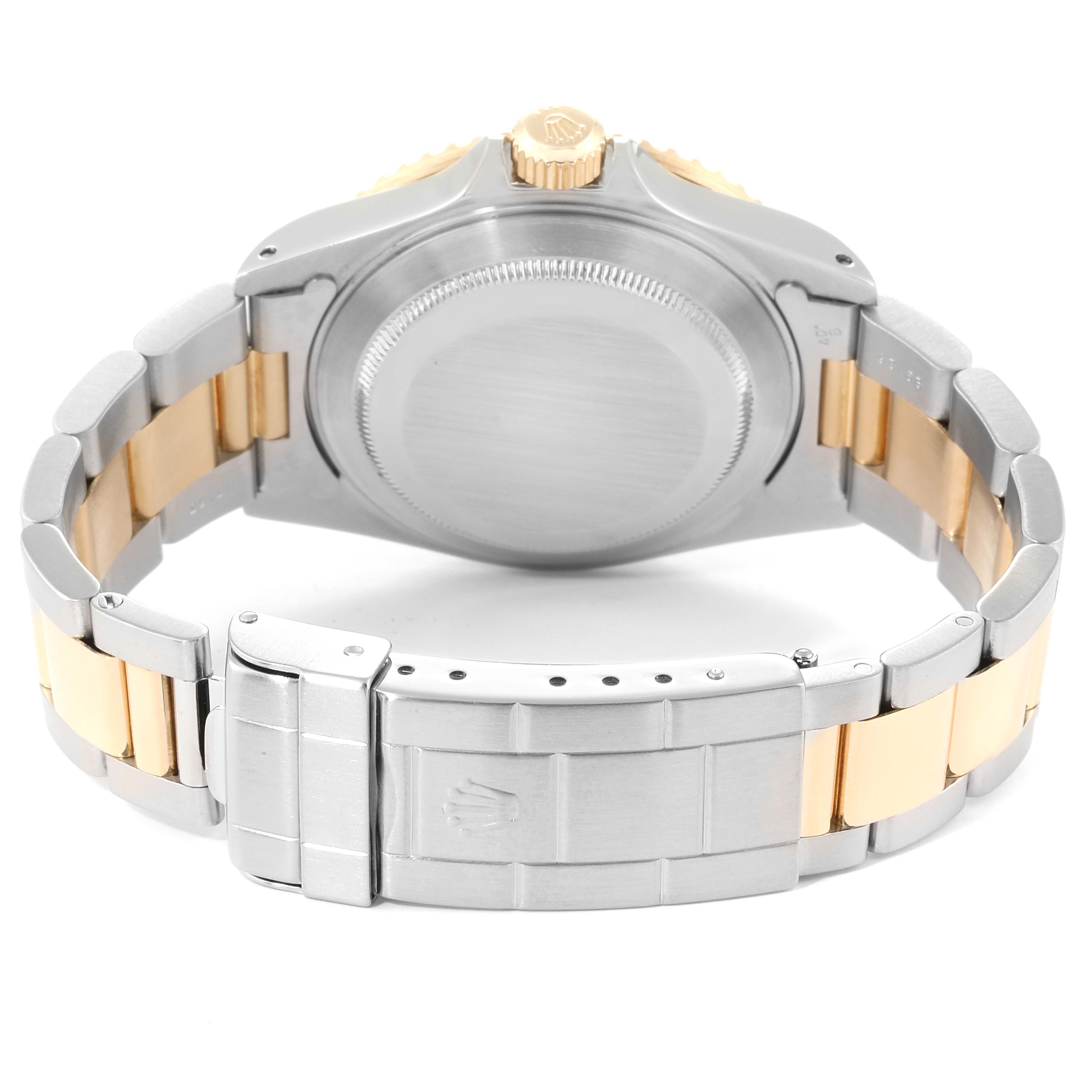 This is a rear view of the Rolex Submariner 16613 Men
s Steel and Gold (two tone) Blue Dial 16613 Men
s Steel and Gold (two tone) Blue Dial, showing the case back and the two-tone bracelet with a clasp.