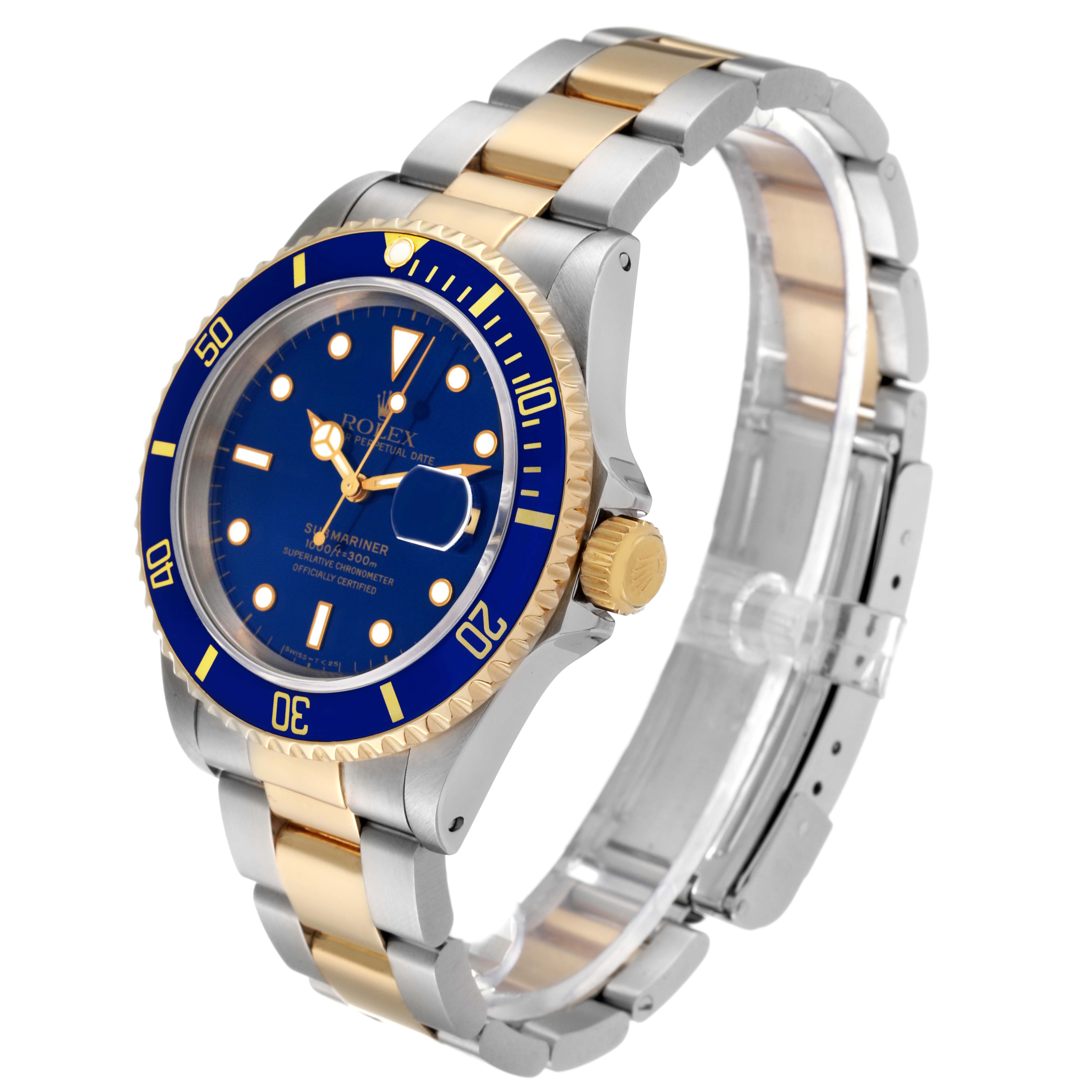 The image shows a Rolex Submariner 16613 Men's Steel and Gold (two tone) Blue Dial 16613 Men's Steel and Gold (two tone) Blue Dial watch from a front-side angle, highlighting its blue dial, bezel, and two-tone bracelet.