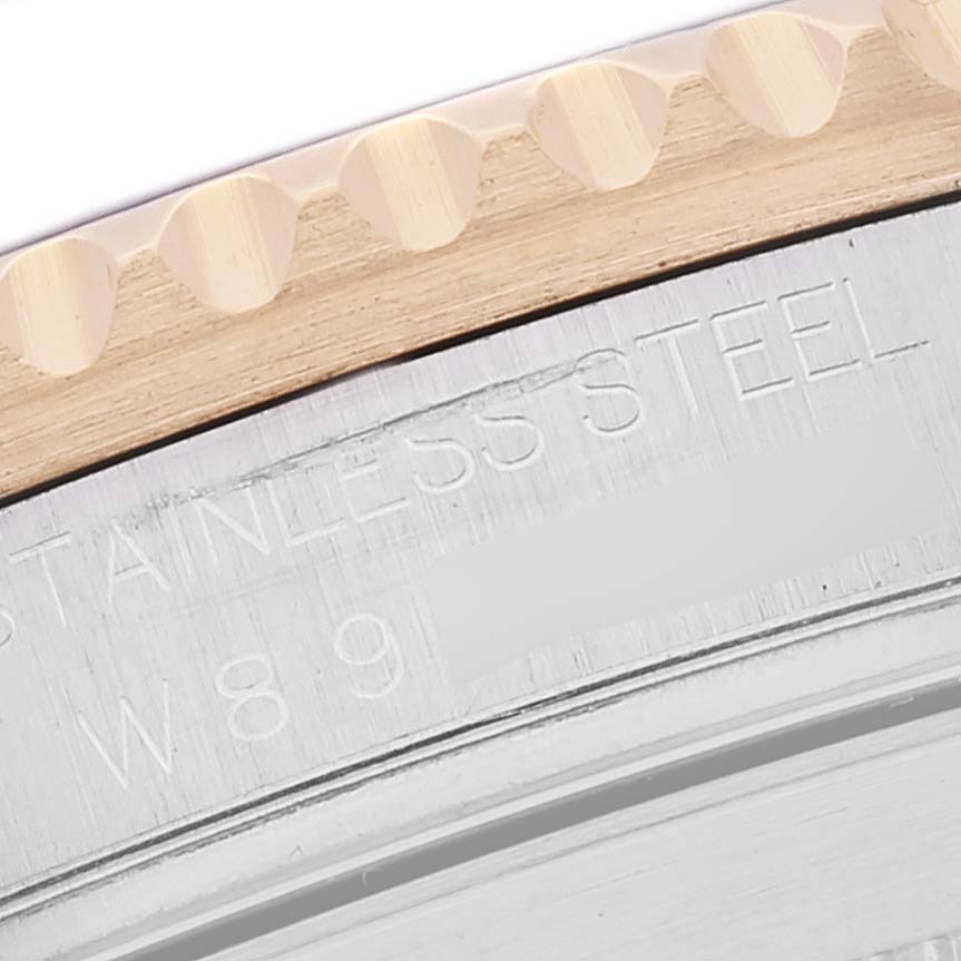 This close-up angle shows the bezel and stainless steel case of the Rolex Submariner 16613 Men's Steel and Gold (two tone) Blue Dial 16613 Men's Steel and Gold (two tone) Blue Dial watch.