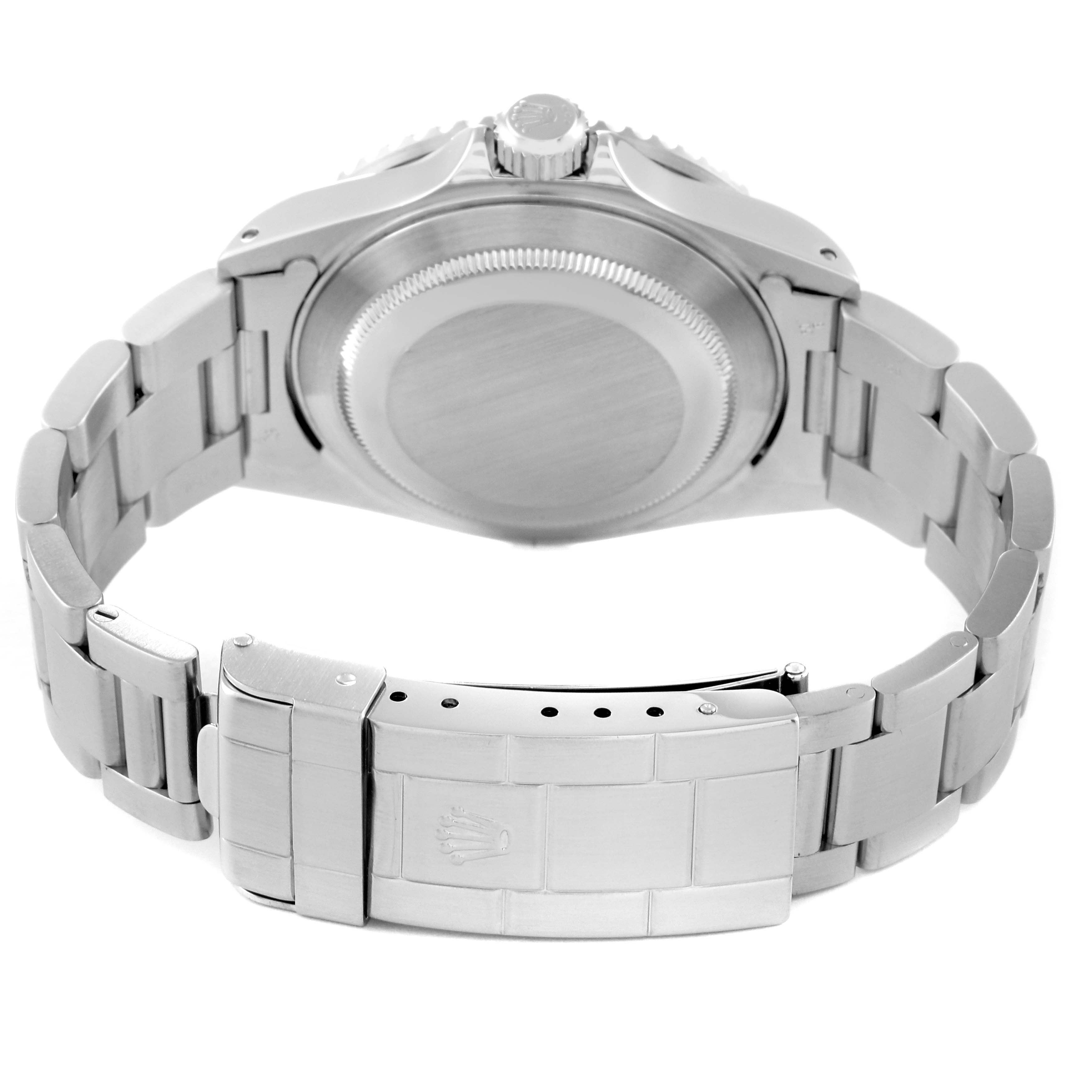 The image shows the back view of a Rolex Submariner 16610 Men
s Stainless Steel Black Dial 16610 Men
s Stainless Steel Black Dial watch, focusing on the case back and bracelet clasp.