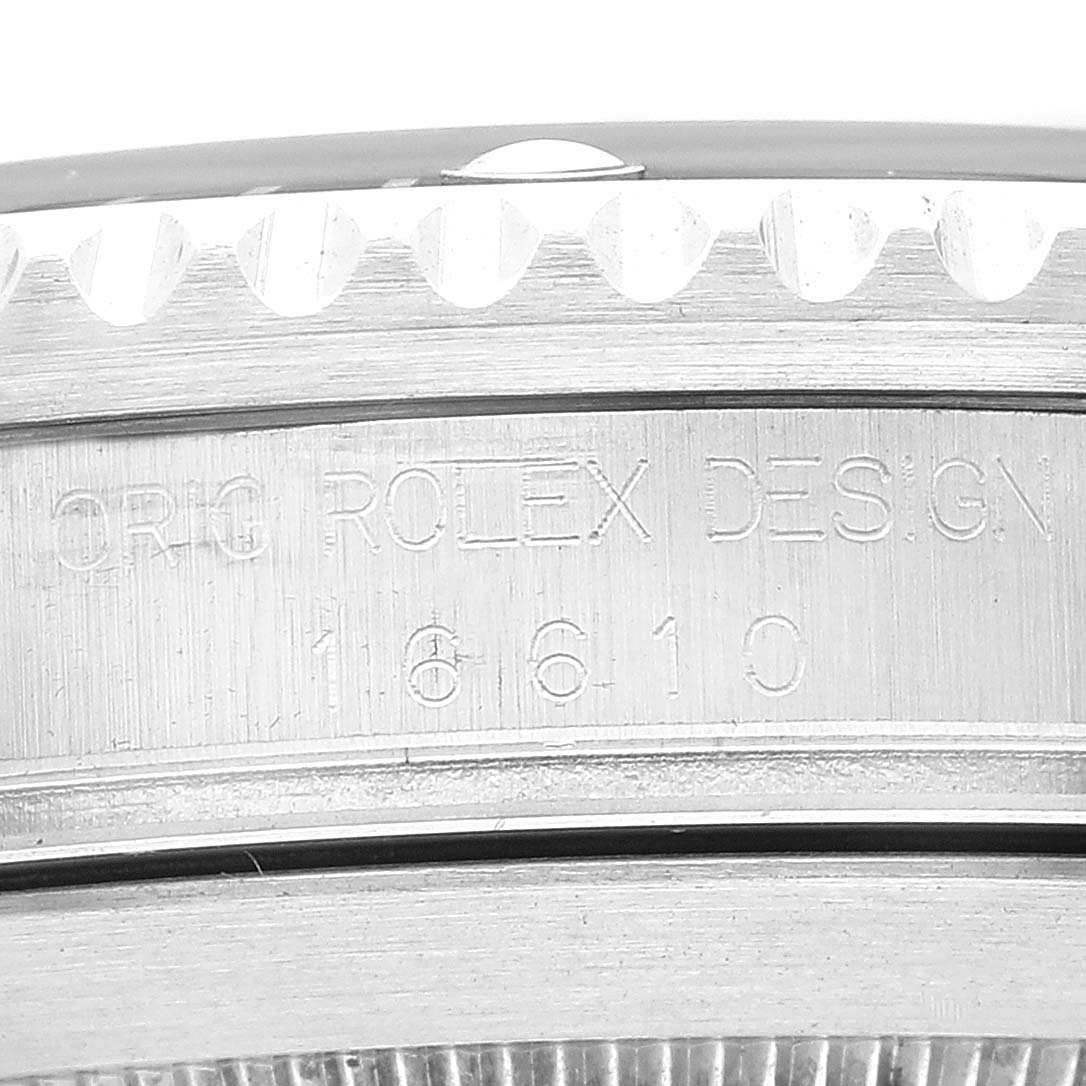 This image shows a close-up of the model number engraving on the side of a Rolex Submariner 16610 Men
s Stainless Steel Black Dial 16610 Men
s Stainless Steel Black Dial watch case.