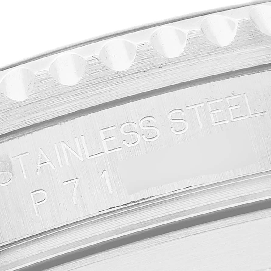 This close-up image shows the case back of a Rolex Submariner 16610 Men
s Stainless Steel Black Dial 16610 Men
s Stainless Steel Black Dial watch, highlighting the stainless steel engraving.