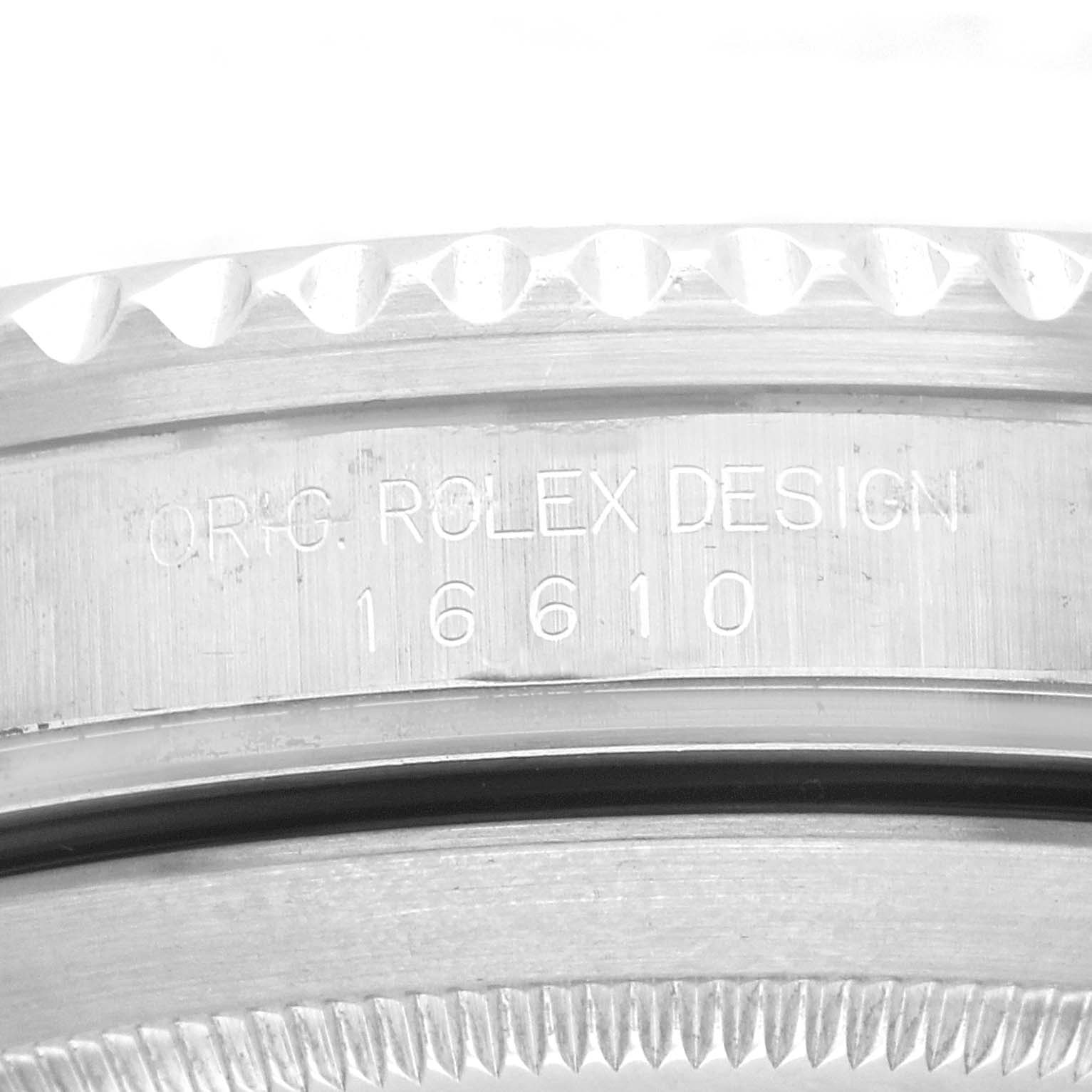 The image shows an angled close-up of the case side, engraving, and bezel of the Rolex Submariner, model number 16610.