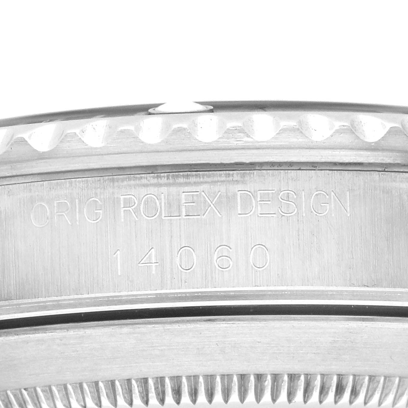 The image shows a close-up side view of the engraved edge of a Rolex Submariner, model number 14060, focusing on the bezel and engravings.