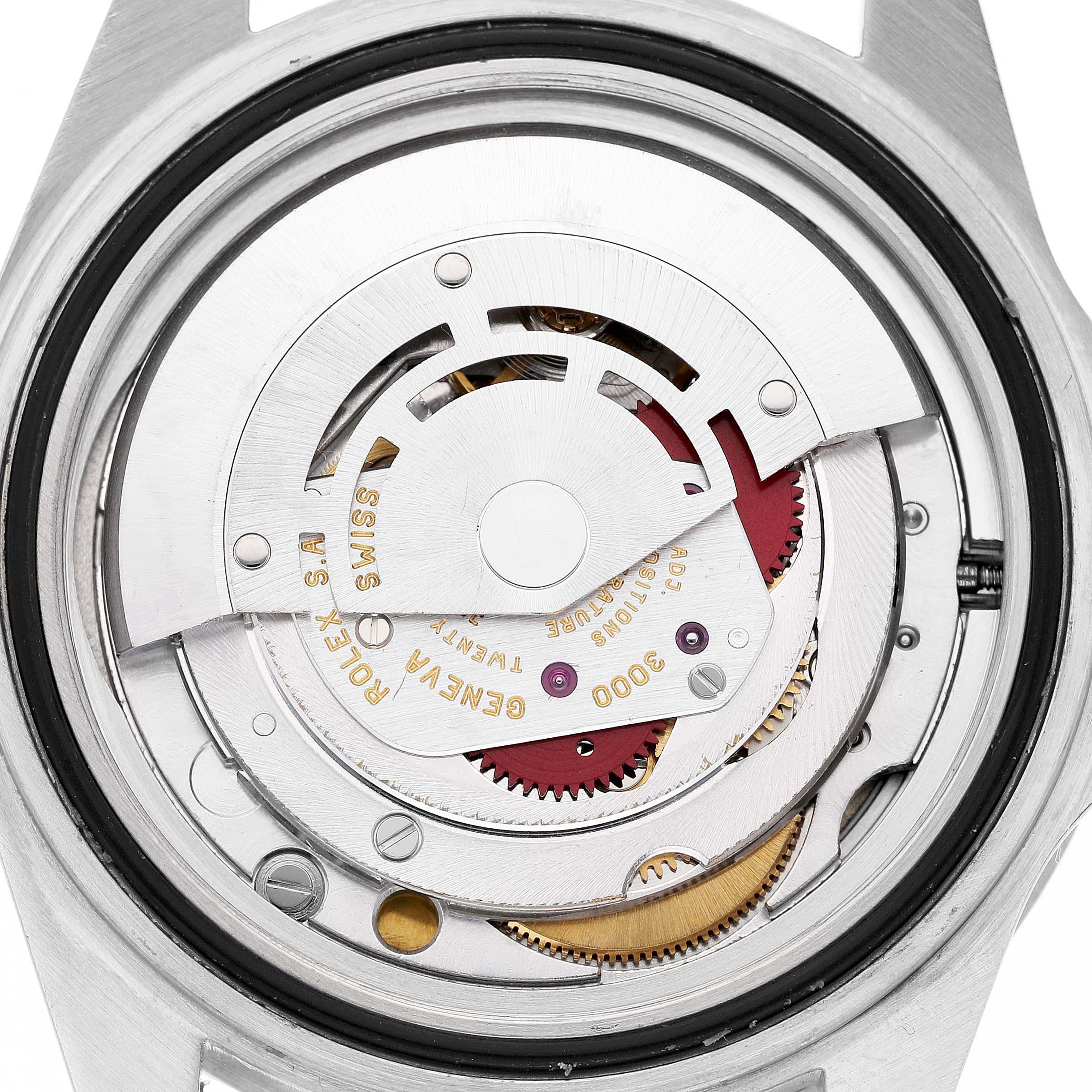 The image shows the open case back of a Rolex Submariner 14060 Men's Stainless Steel Black Dial, revealing its intricate movement components.