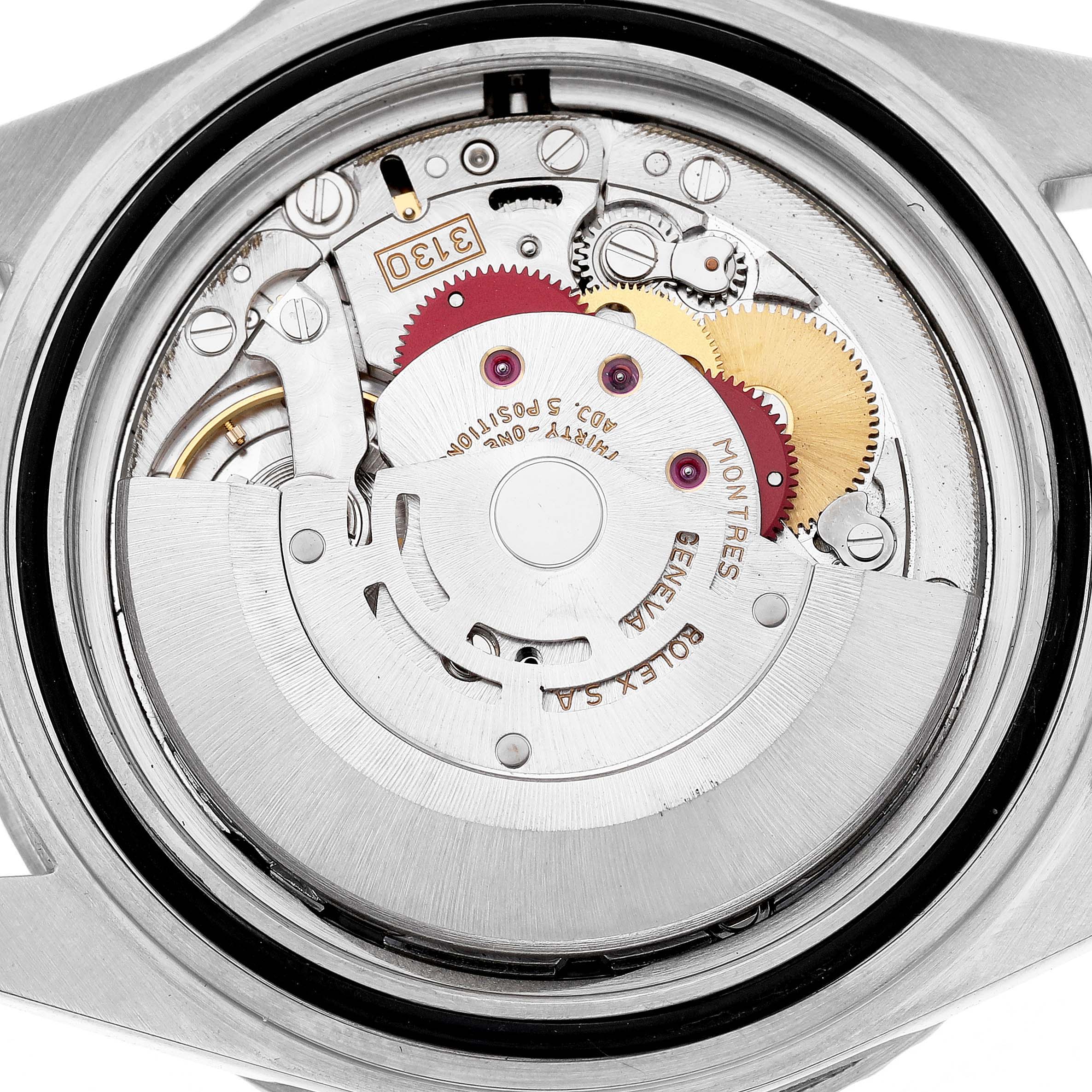 The image shows the movement of a Rolex Submariner 14060 Men's Stainless Steel Black Dial, viewed from the back, highlighting its internal components.