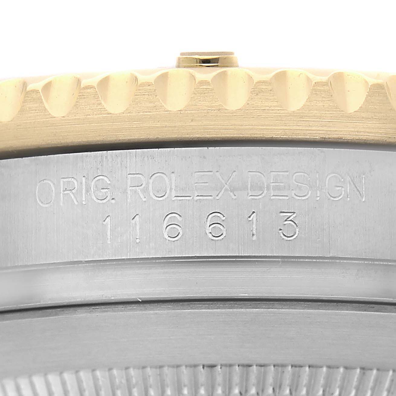 The image shows a close-up of the Rolex Submariner 116613 Men's Steel and Gold (two tone) Black Dial's side, highlighting the engraved serial number and watch case.