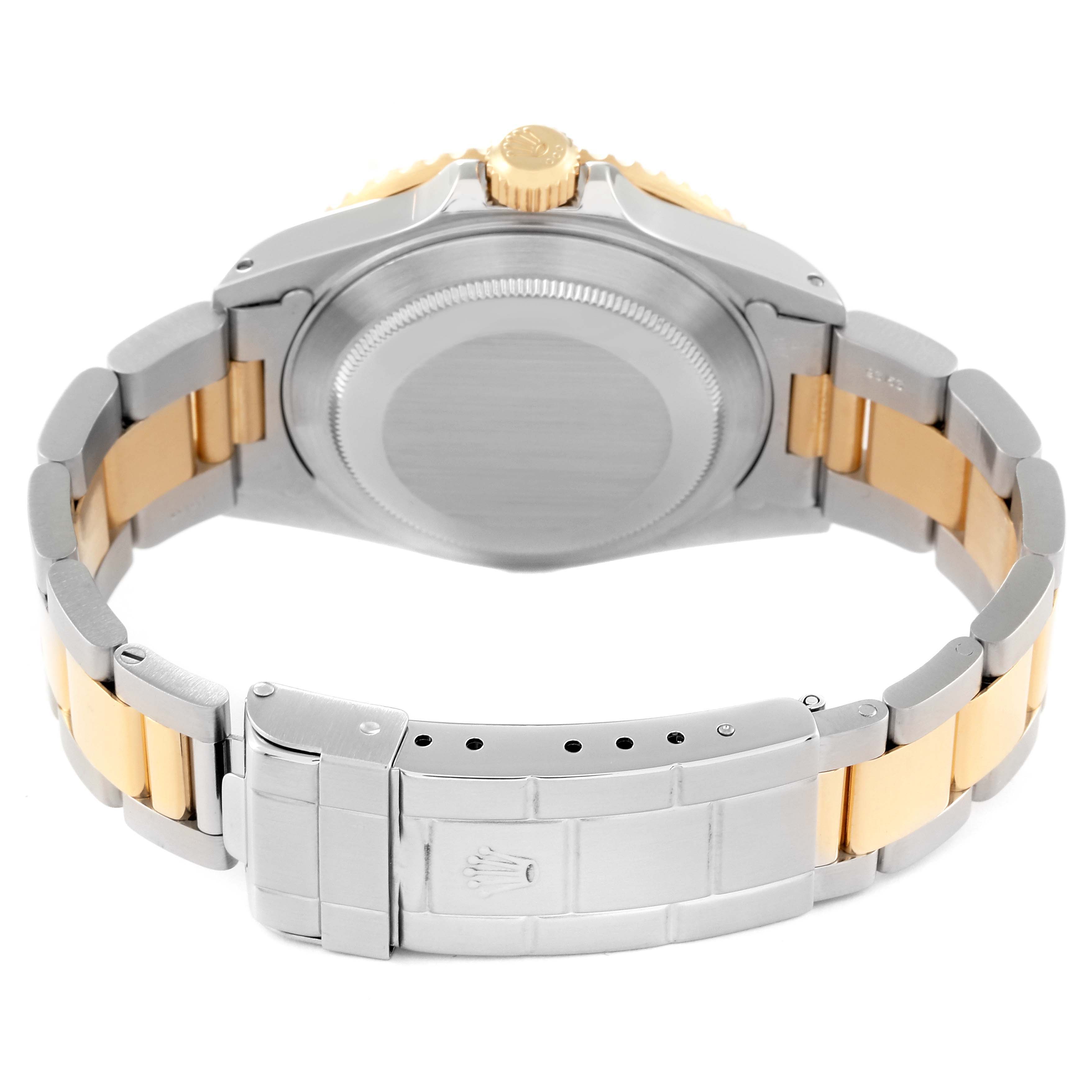 This image shows the back and bracelet of a Rolex Submariner 16613 Men's Steel and Gold (two tone) Champagne Dial 16613 Men's Steel and Gold (two tone) Champagne Dial, including the clasp and case back.
