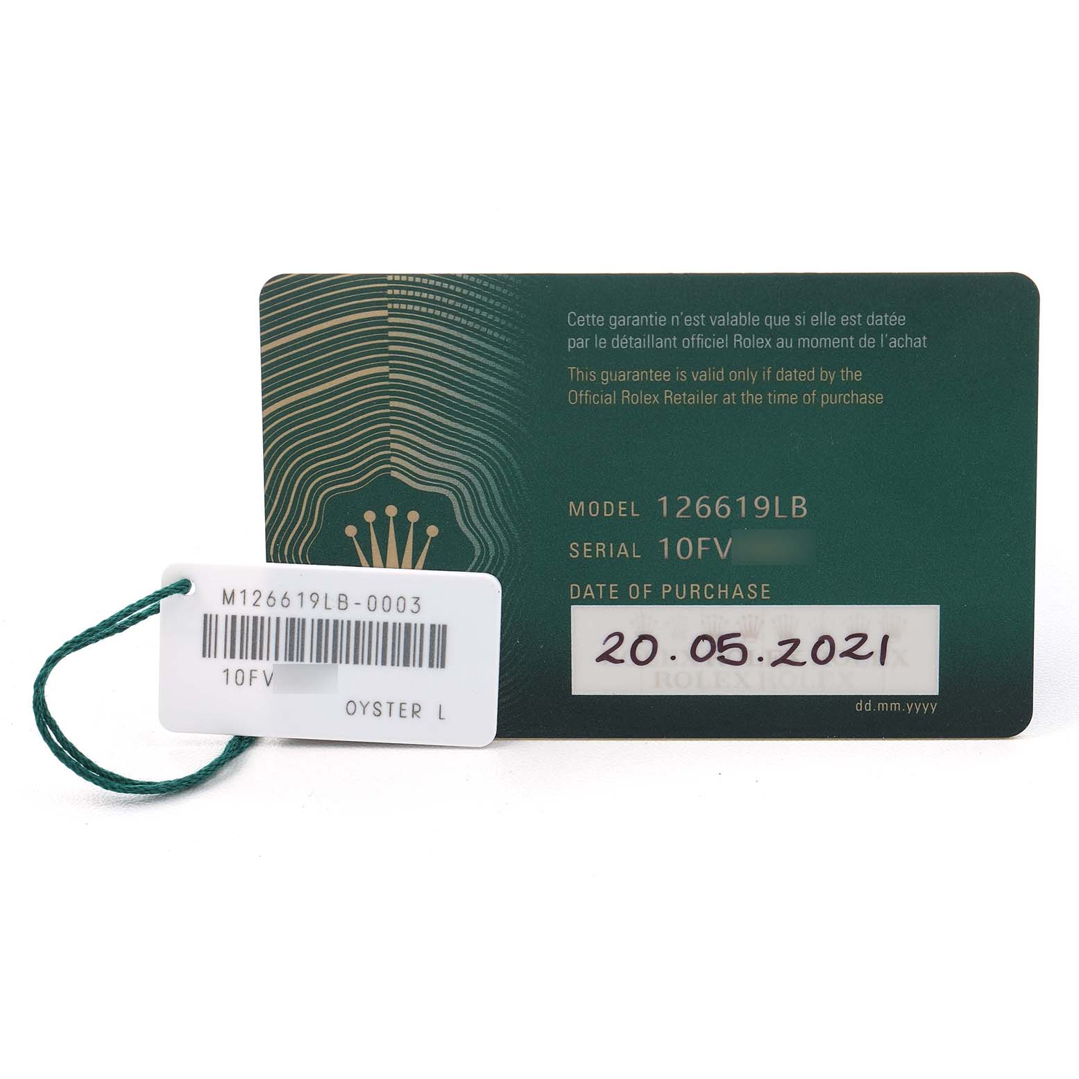 The image displays a guarantee card and tag for the Rolex Submariner 126619 Men's White Gold Black Dial model 126619LB, showing model and serial numbers.