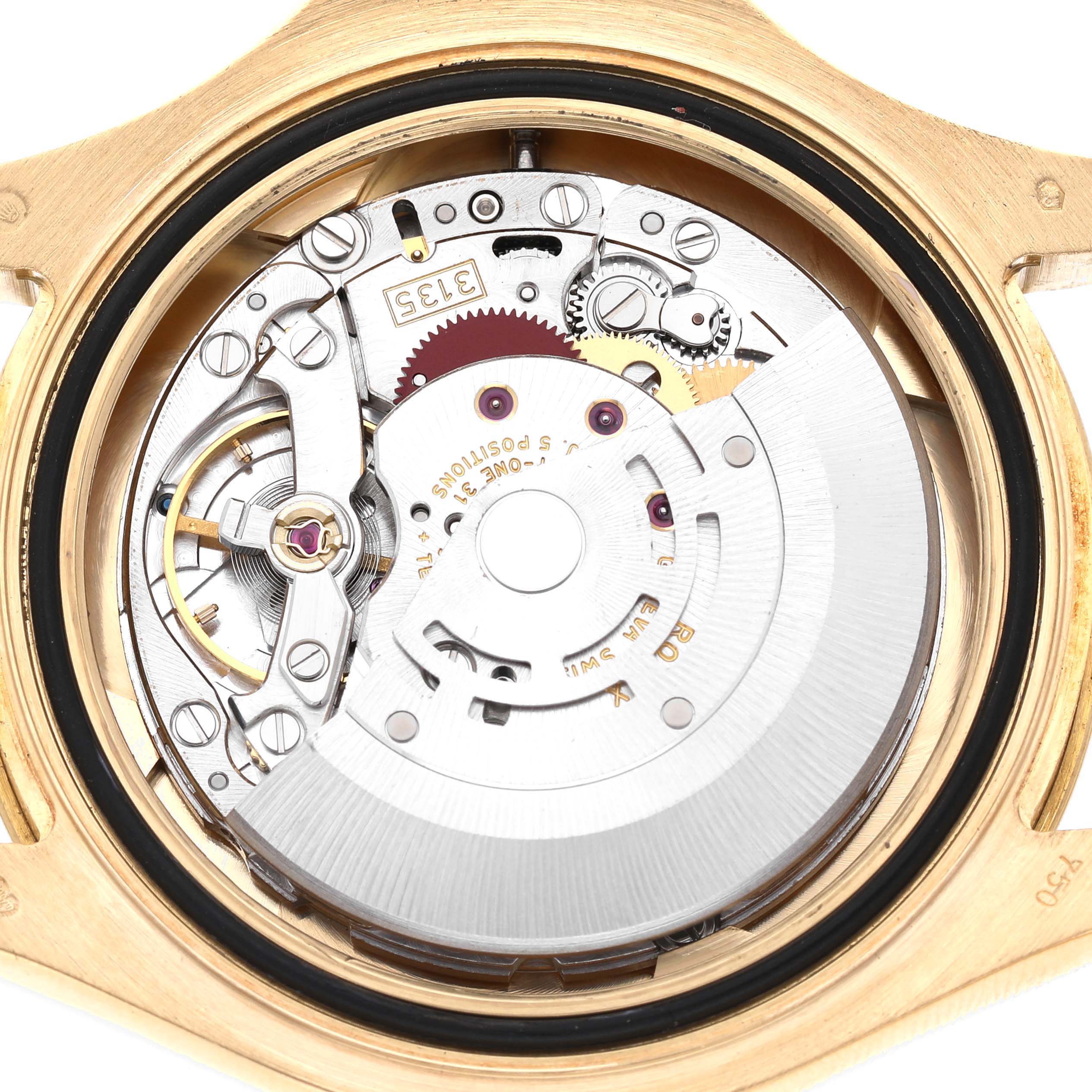 The image shows the movement of a Rolex Yacht-Master 16628 Men's Yellow Gold White Dial watch from a top-down angle, highlighting its intricate internal mechanics.