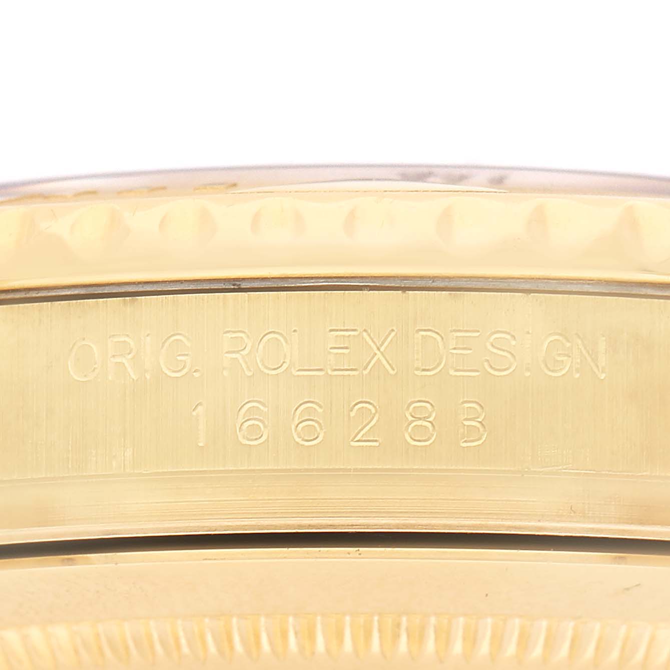 The image shows a close-up of the side of a Rolex Yacht-Master 16628 Men's Yellow Gold White Dial watch, highlighting the model and design number engraving.