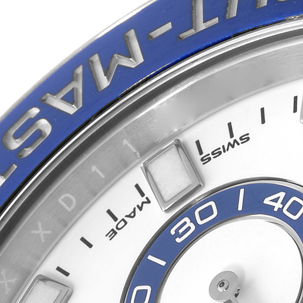 This image shows a close-up of the bezel, hour markers, and part of the dial of a Rolex Yacht-Master 116680 Men's Stainless Steel White Dial 116680 Men's Stainless Steel White Dial watch.