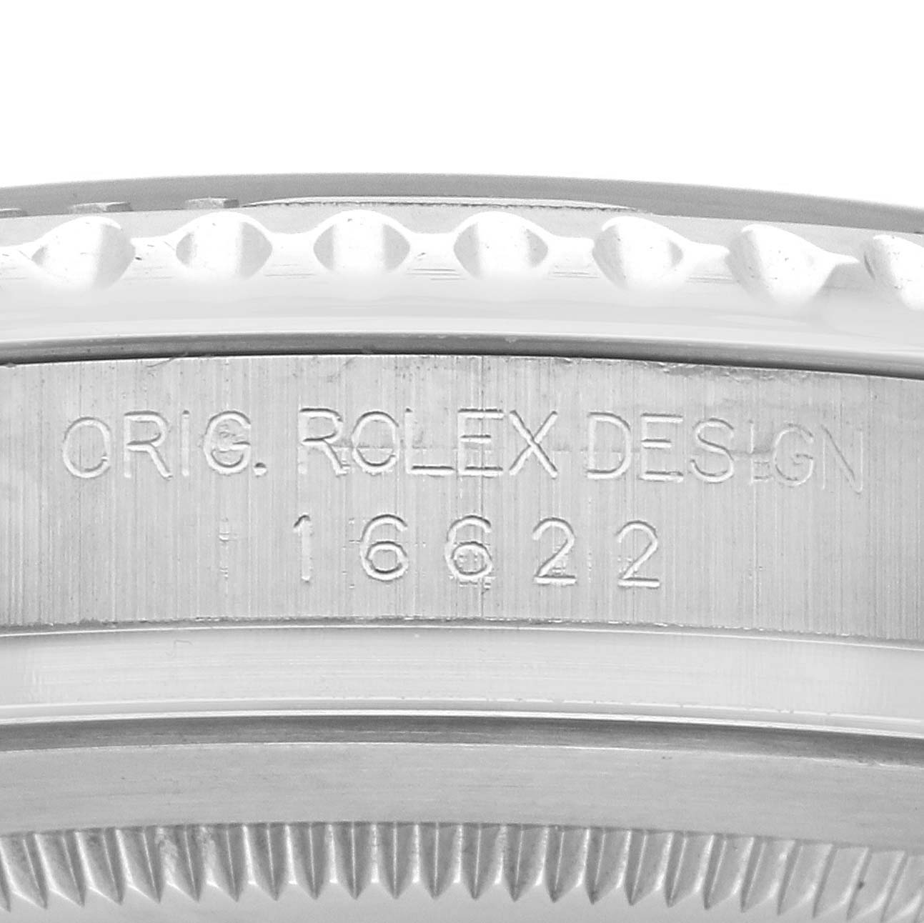 The image shows a close-up of the side of a Rolex Yacht-Master model 16622, focusing on the engraved "ORIG. ROLEX DESIGN" and the model number.