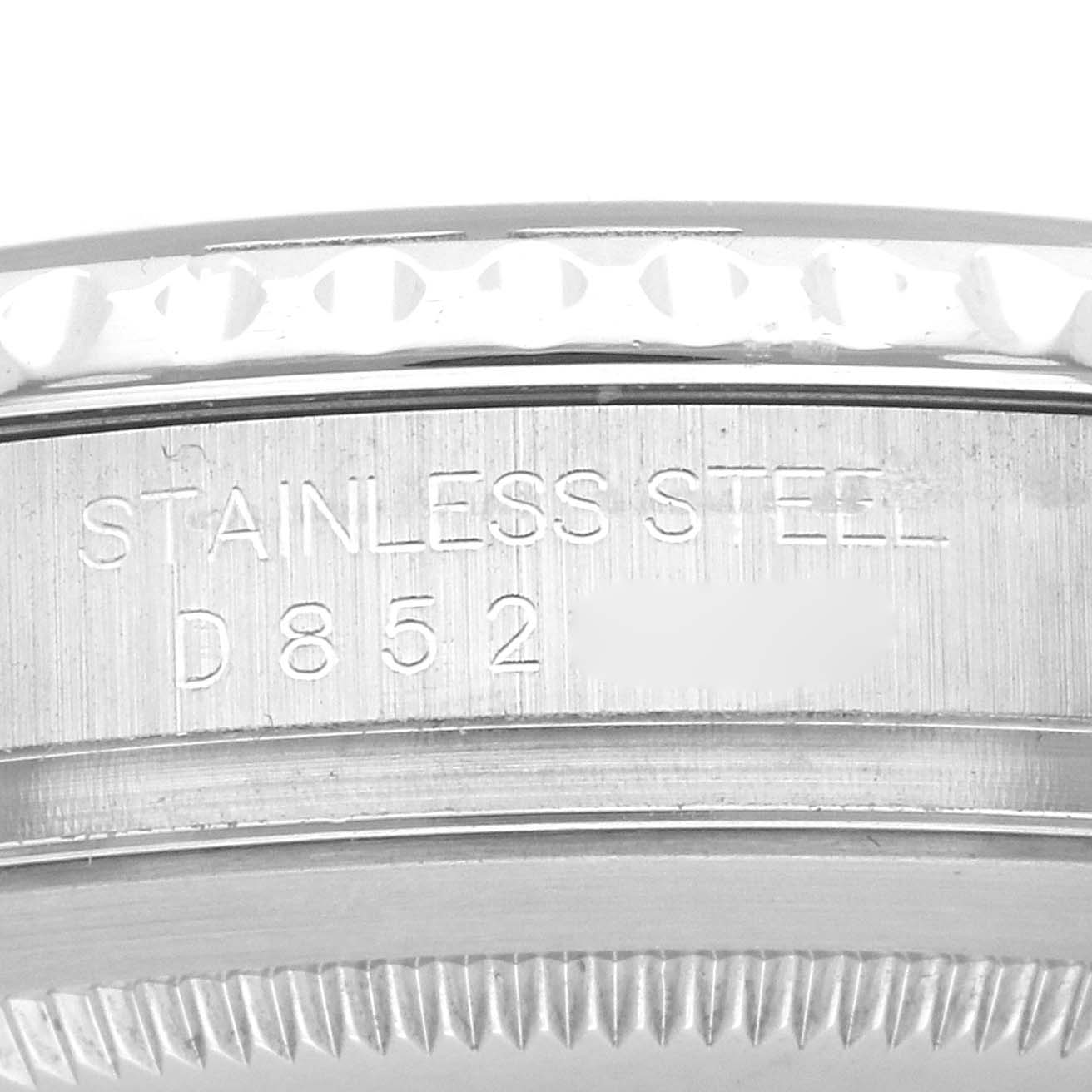 The image shows a close-up of the side of a Rolex Yacht-Master model 16622, highlighting the stainless steel engraving on the bezel and case.