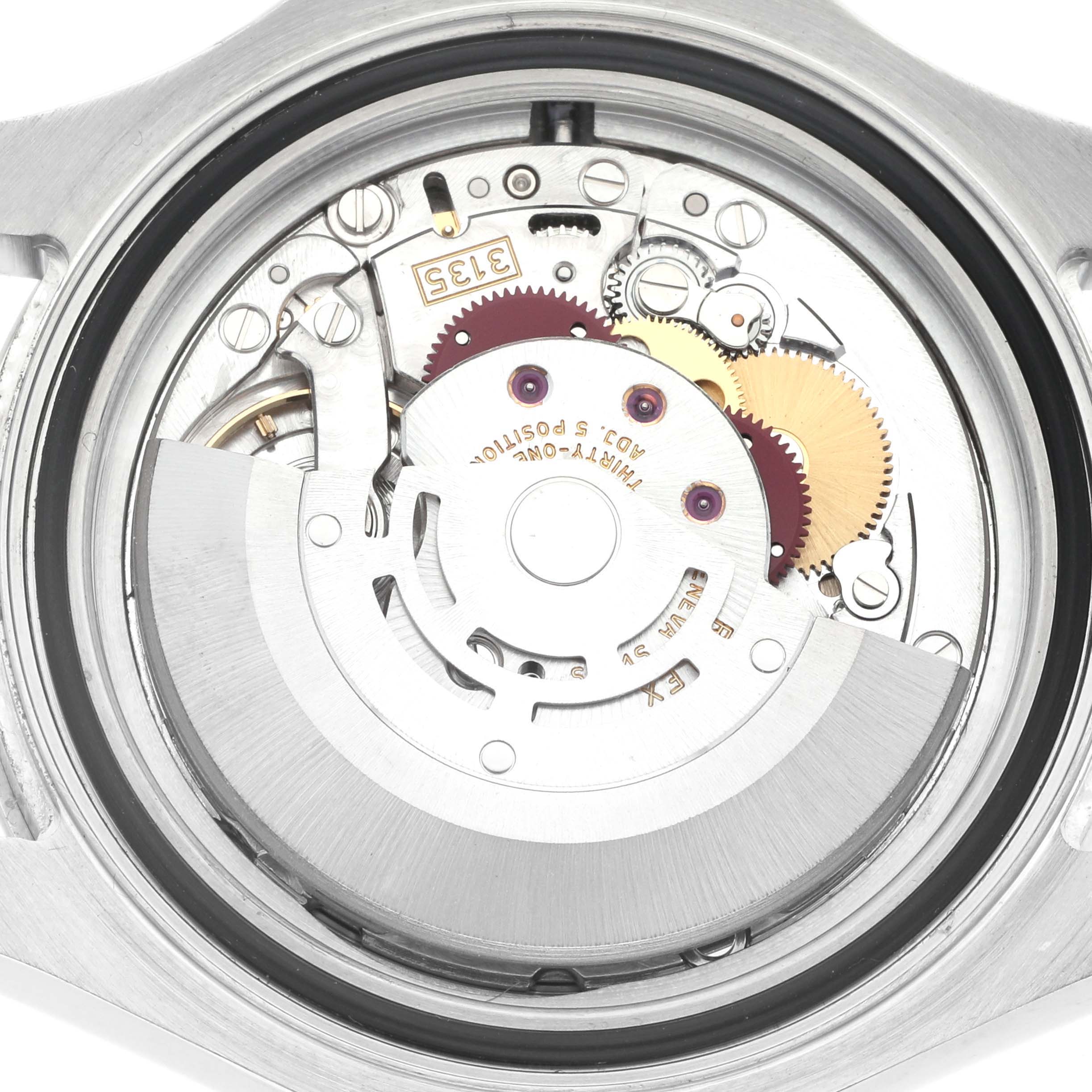 The image shows the movement inside a Rolex Yacht-Master model 16622 from the back, highlighting gears and the rotor of the watch.