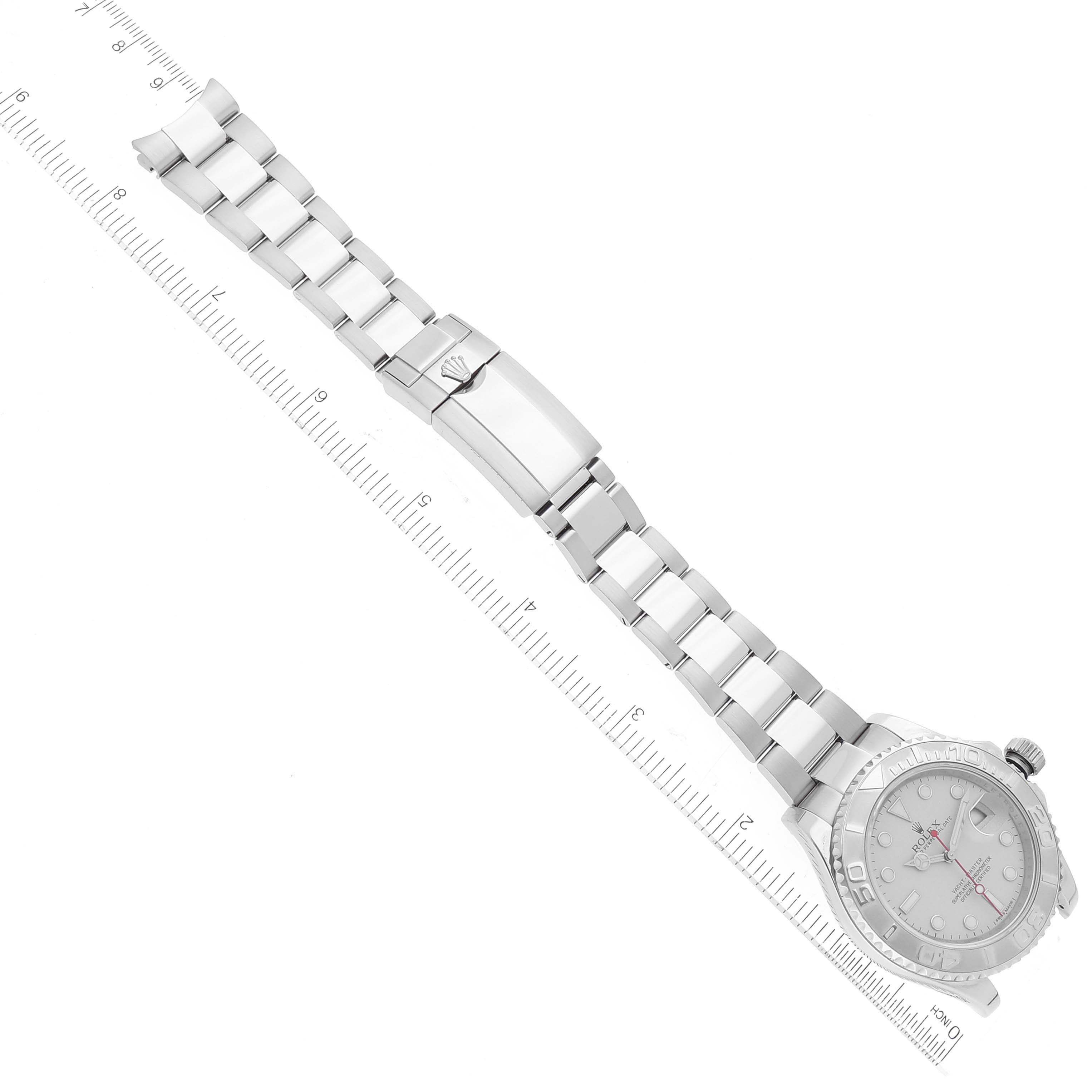 The Rolex Yacht-Master 116622 Men
s Stainless Steel Silver Dial 116622 Men
s Stainless Steel Silver Dial watch is shown from an overhead angle, displaying the face, crown, bracelet, and clasp.