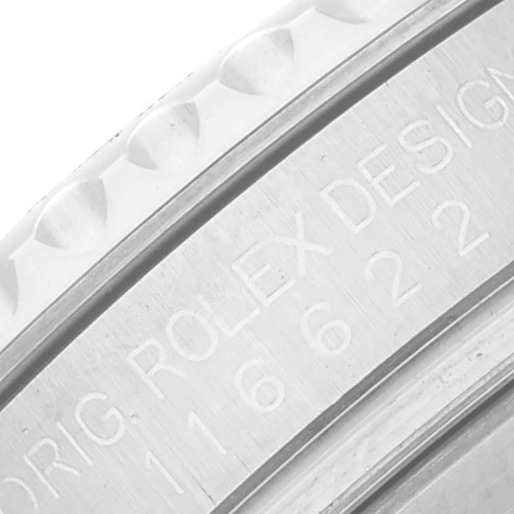 The image shows a close-up of the bezel and engraved text on the case of a Rolex Yacht-Master 116622 Men
s Stainless Steel Silver Dial 116622 Men
s Stainless Steel Silver Dial watch.