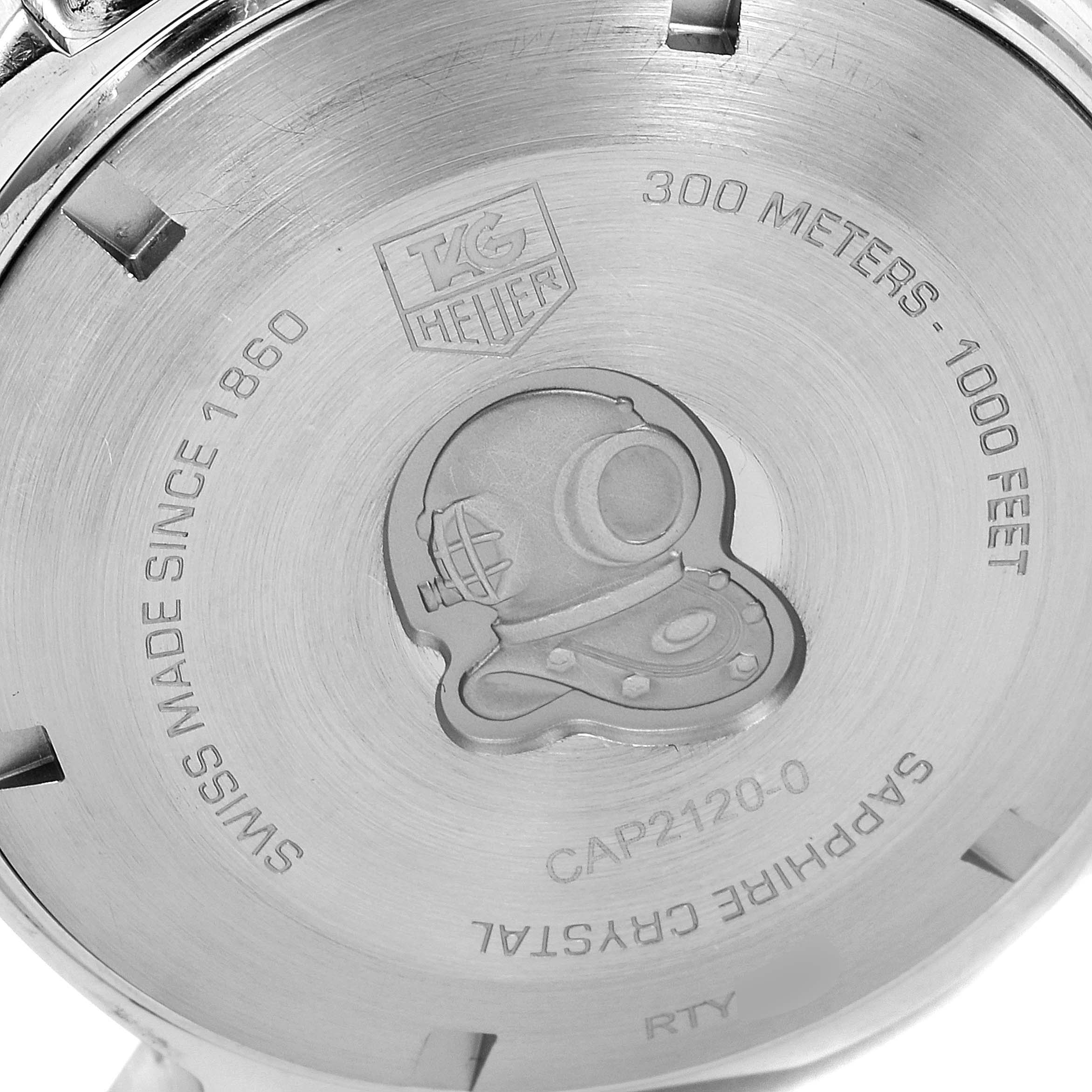 This image shows the back case of a Tag Heuer Aquaracer CAP2120.BB0834 Men's Steel and Gold (two tone) Silver Dial CAP2120.BB0834 Men's Steel and Gold (two tone) Silver Dial watch, featuring an engraved diving helmet, brand engraving, and specifications.
