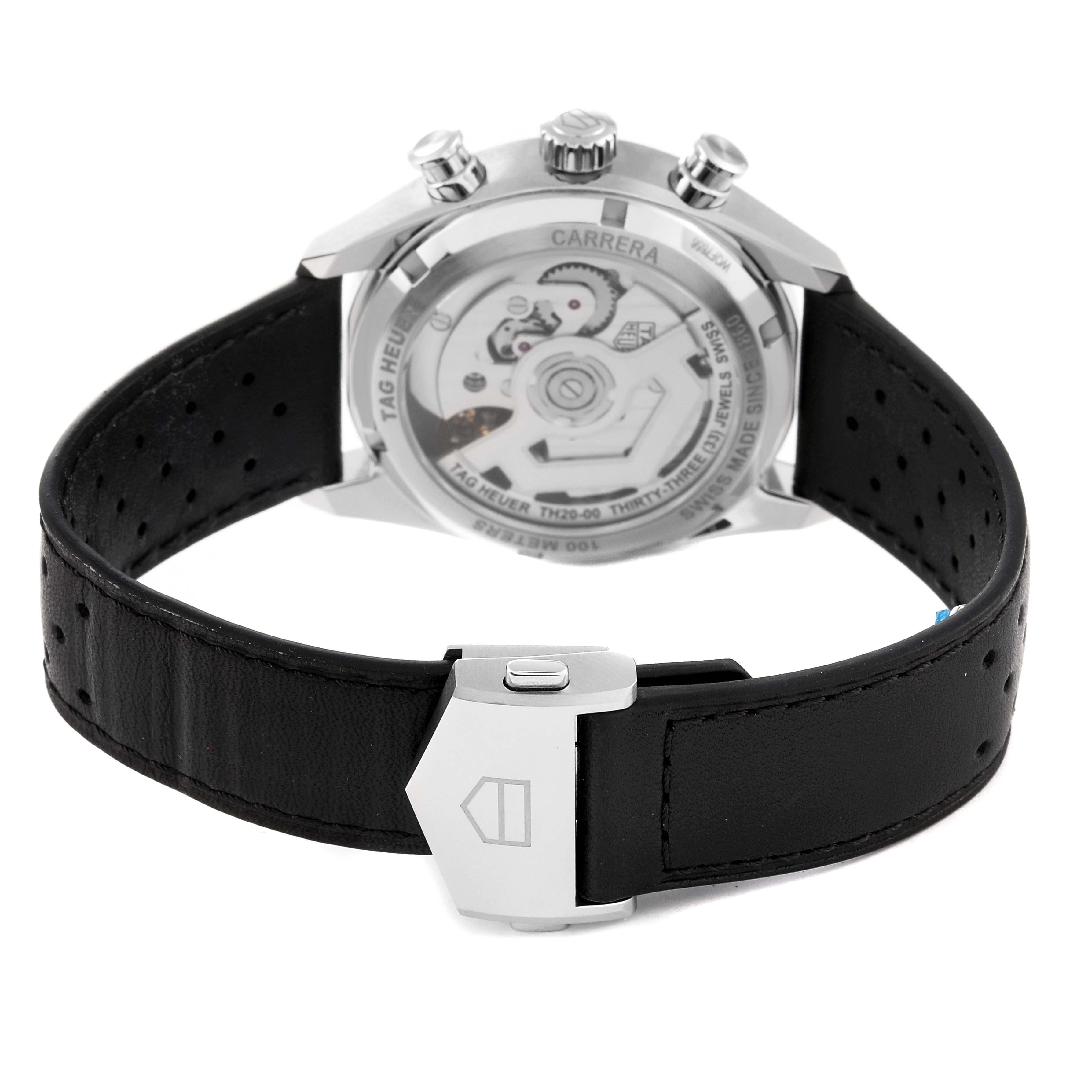 The image shows the back view of a Tag Heuer Carrera CBS2210.FC6534 Men's Stainless Steel Black Dial CBS2210.FC6534 Men's Stainless Steel Black Dial watch, highlighting its movement and leather strap with clasp.