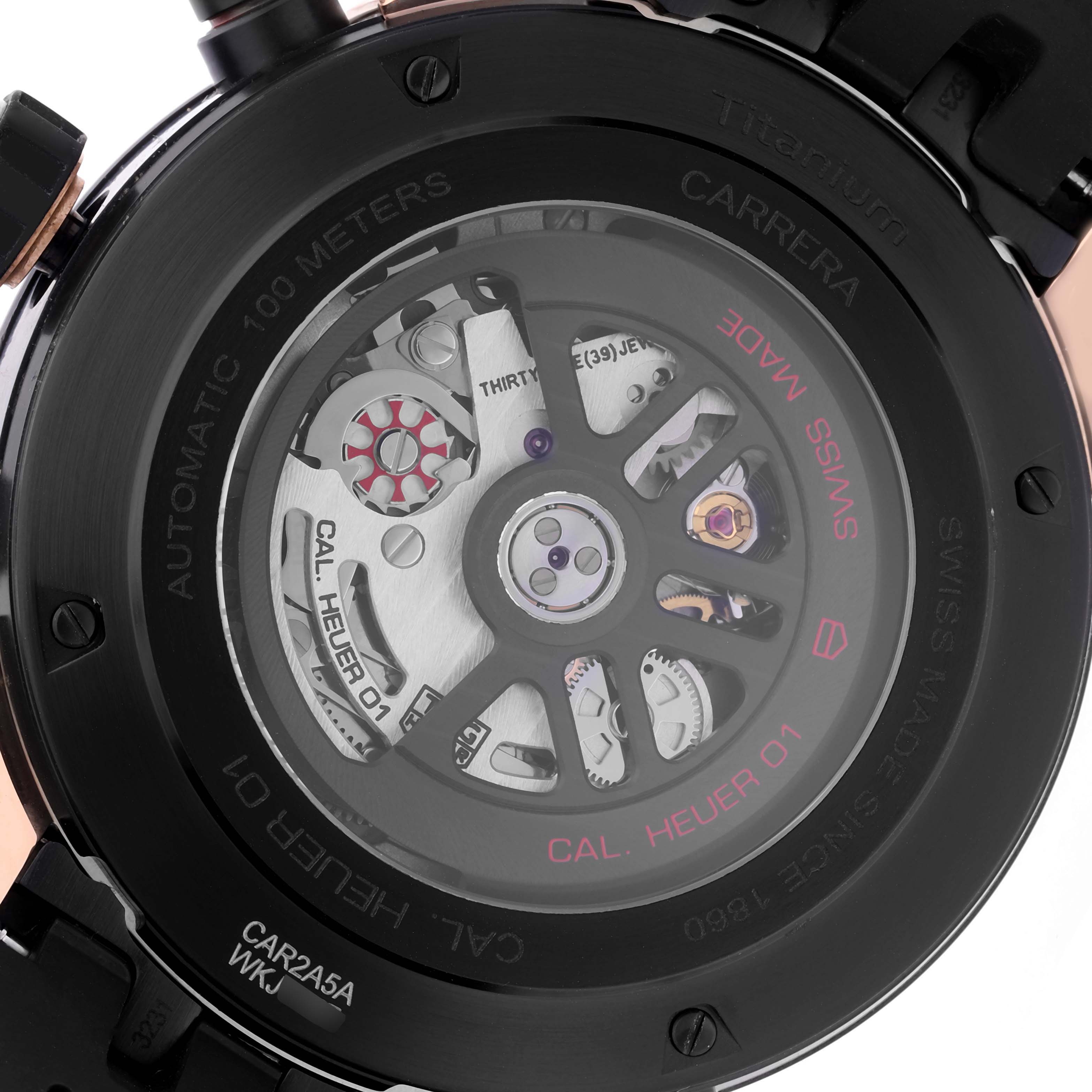 The image shows the back view of a Tag Heuer Carrera CAR2A5A Men's Titanium Black Dial CAR2A5A Men's Titanium Black Dial watch, displaying the intricate Cal. Heuer 01 movement.