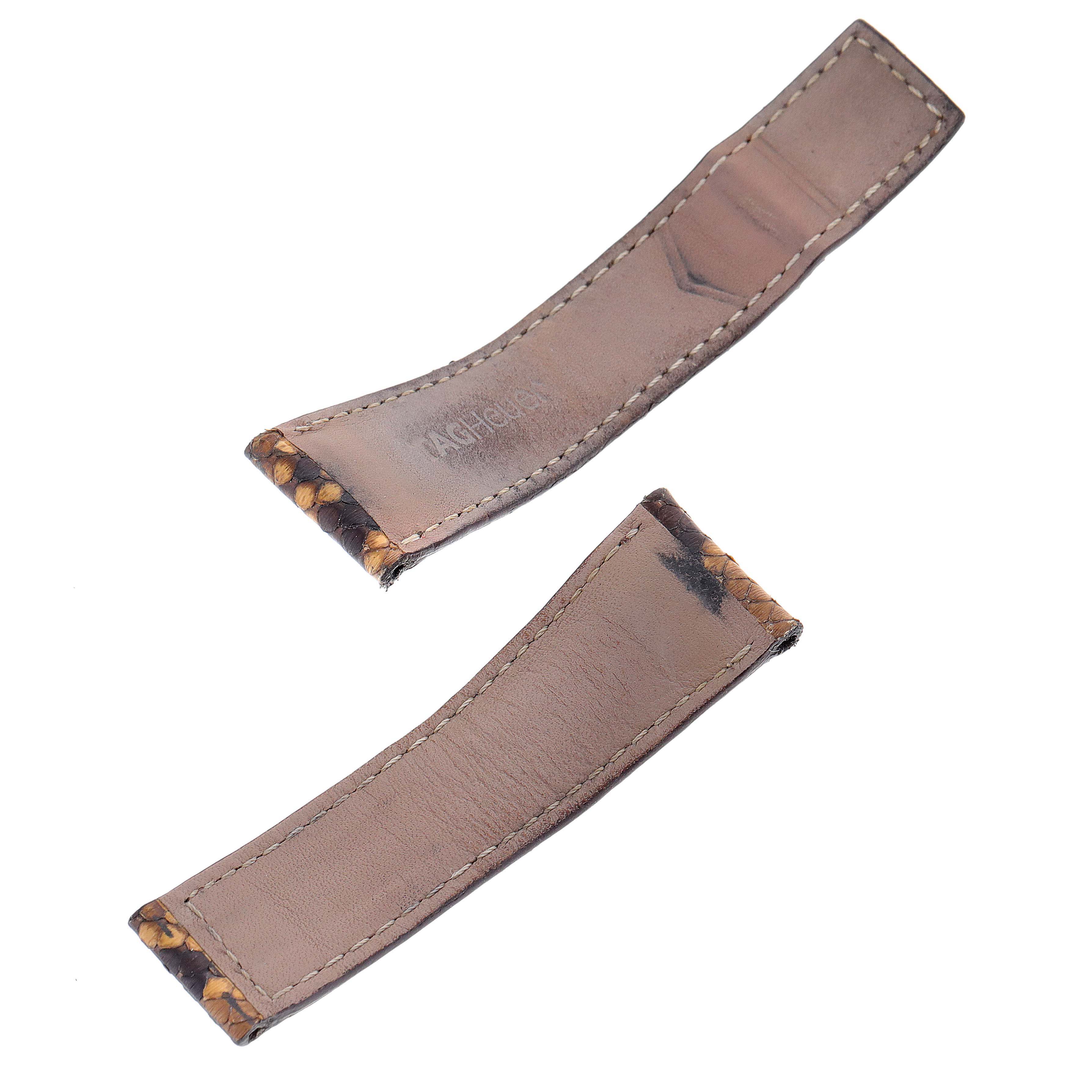 The image shows two detached leather strap pieces for the Tag Heuer Monaco WAW1316.EB0025 Men's Stainless Steel Brown Dial WAW1316.EB0025 Men's Stainless Steel Brown Dial model watch from a top-down angle.