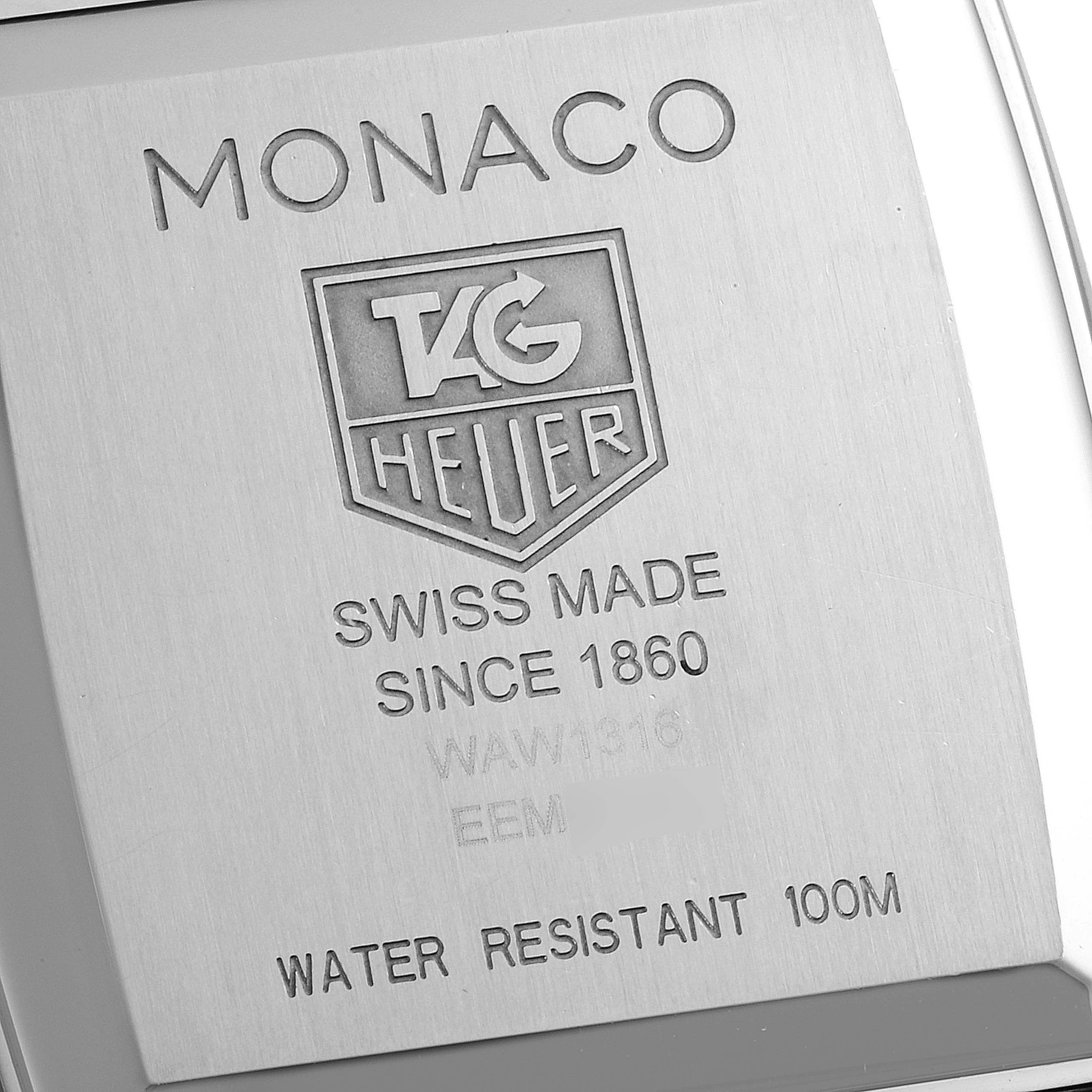 The image shows the back case of a Tag Heuer Monaco WAW1316.EB0025 Men's Stainless Steel Brown Dial WAW1316.EB0025 Men's Stainless Steel Brown Dial watch, displaying the engraved details.