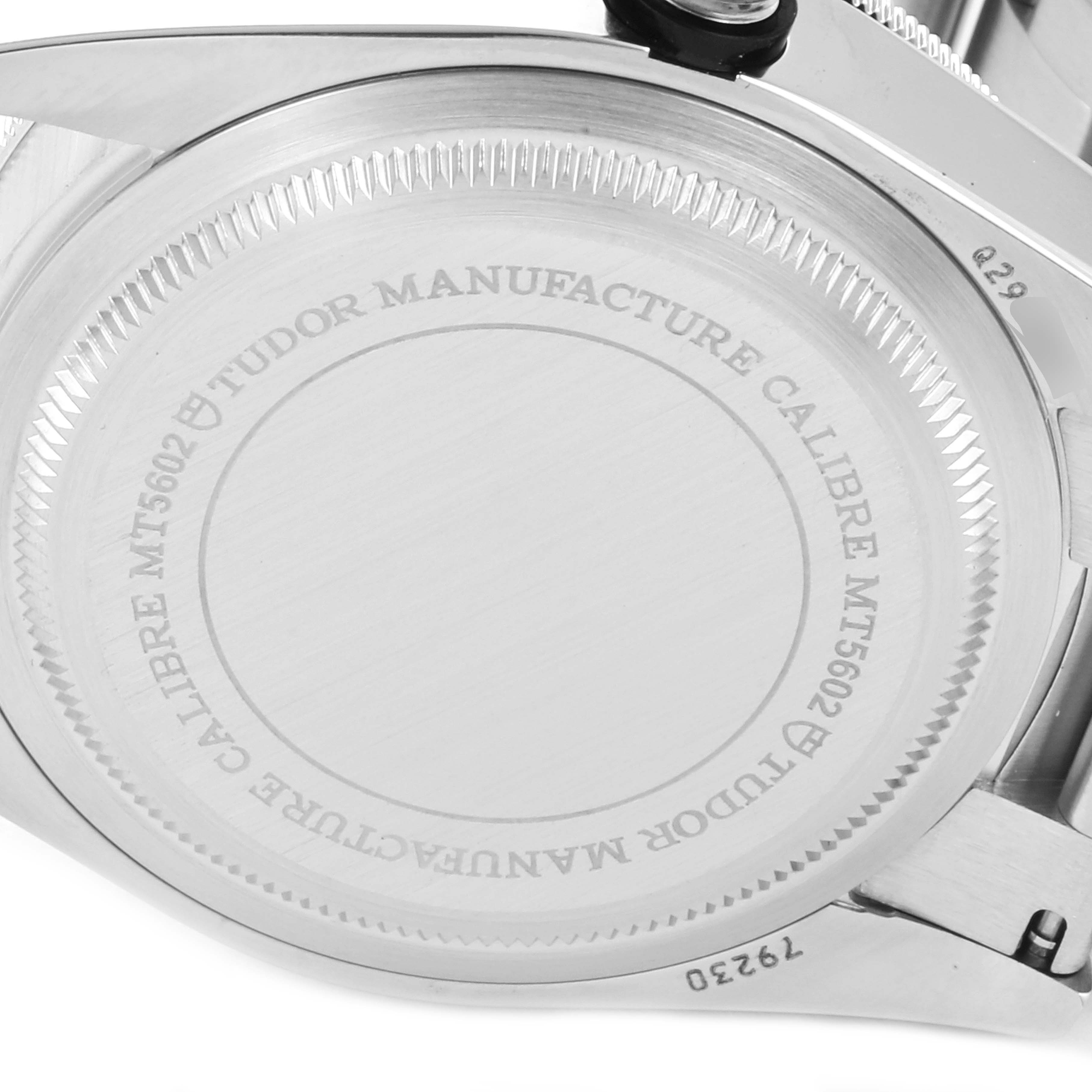 This image shows the case back of the Tudor Heritage Black Bay 79230 Men
s Stainless Steel Black Dial 79230 Men
s Stainless Steel Black Dial watch, displaying the engravings and screw-down back.