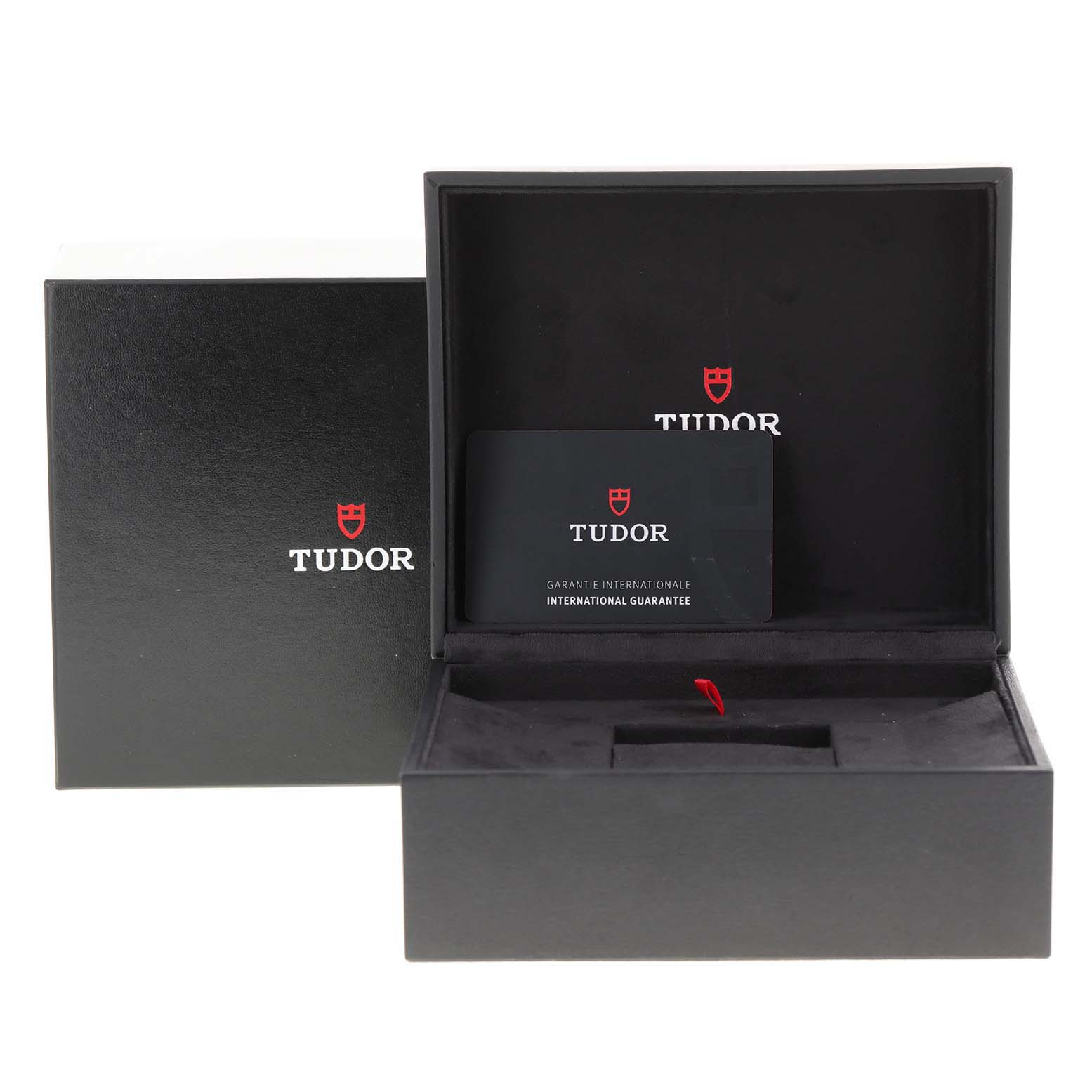 The image shows the packaging and guarantee card for a Tudor Heritage Black Bay 79230 Men
s Stainless Steel Black Dial 79230 Men
s Stainless Steel Black Dial watch.