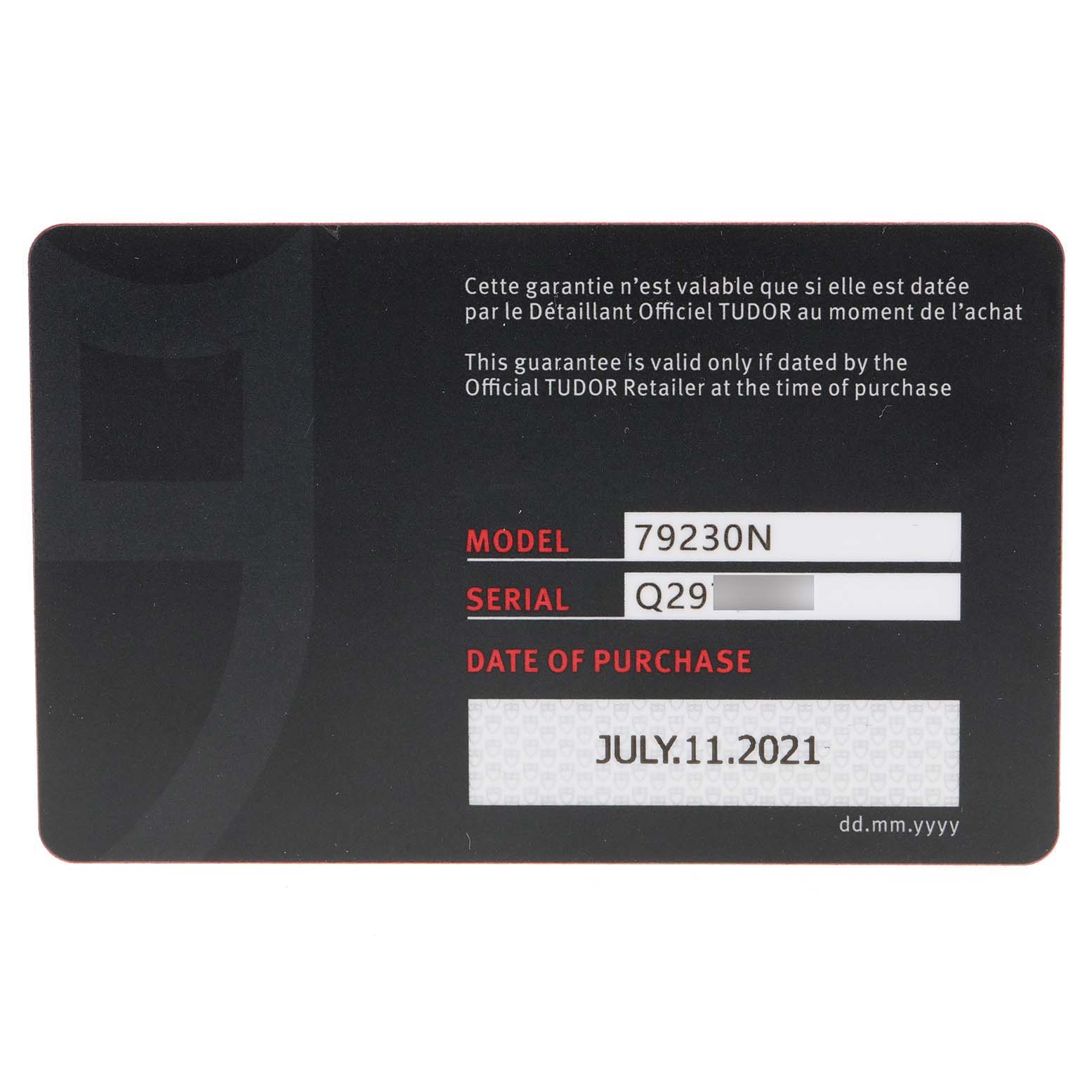 The image shows a warranty card for the Tudor Heritage Black Bay 79230 Men
s Stainless Steel Black Dial 79230 Men
s Stainless Steel Black Dial model 79230N, with purchase date and serial number.