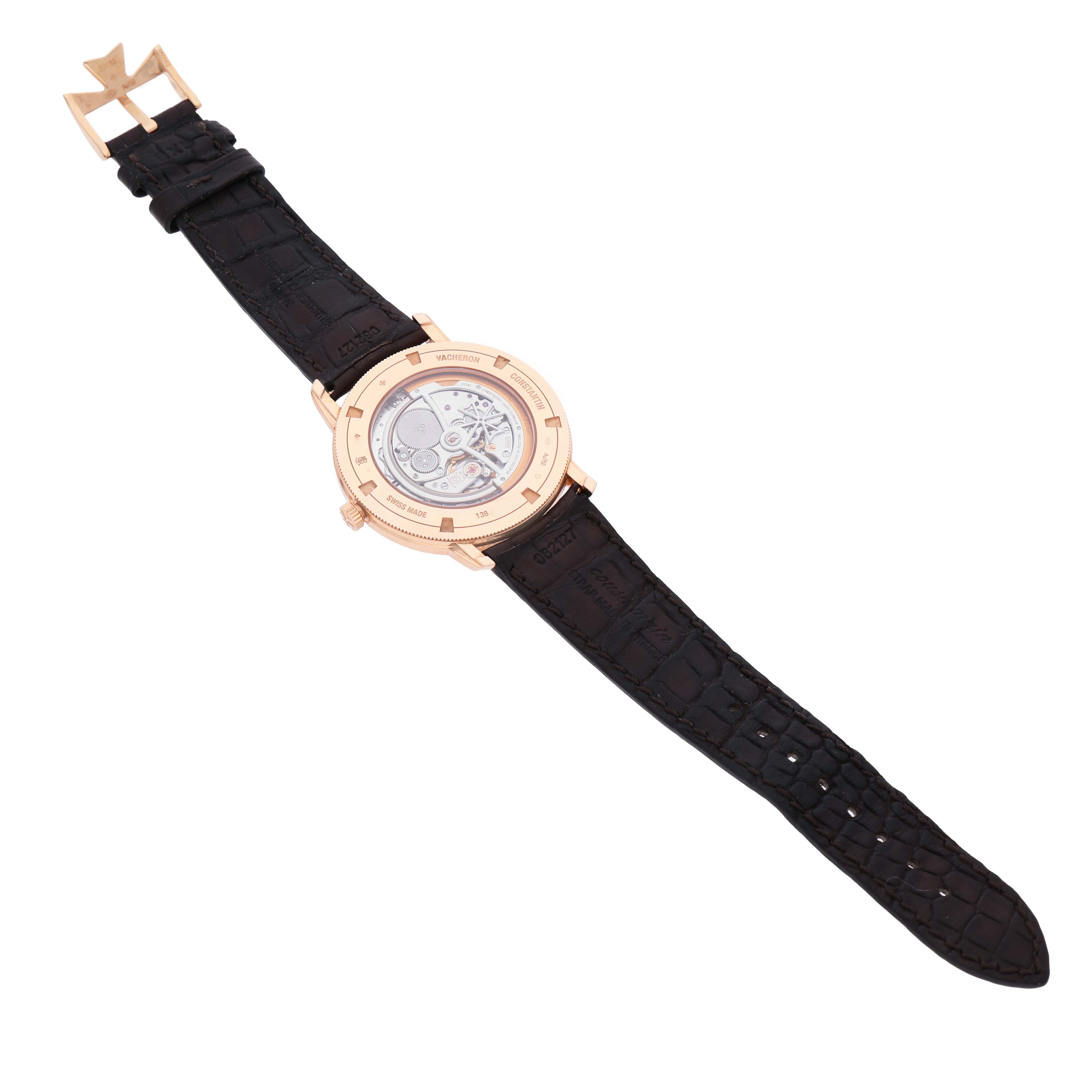 The Vacheron Constantin Traditionnelle 43075/000R-9737 Men's Rose Gold Silver Dial watch is shown from the back, revealing its movement and leather strap.
