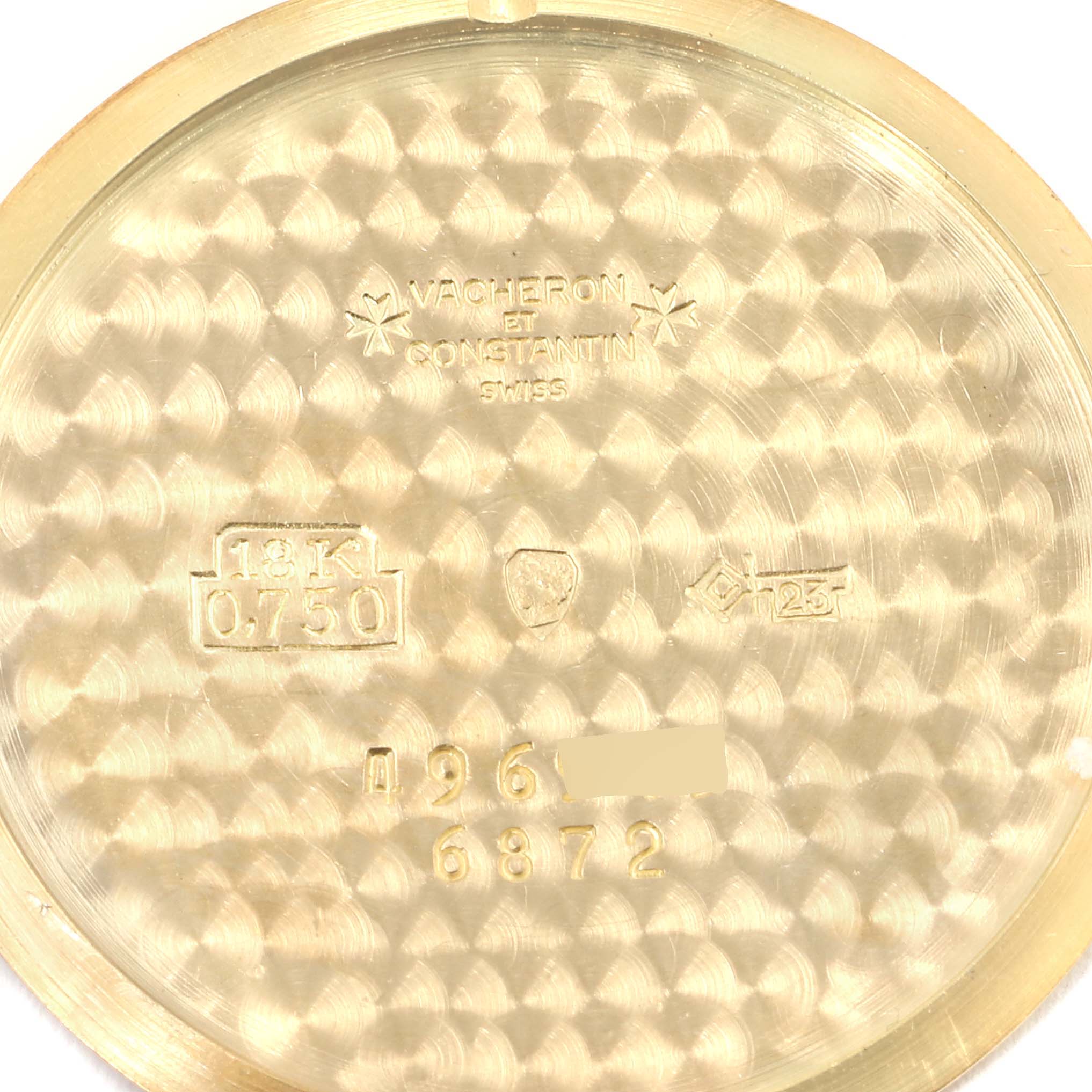 The image shows the inside case back of a Vacheron Constantin Patrimony 6872 Men's Yellow Gold Champagne Dial 6872 Men's Yellow Gold Champagne Dial watch, featuring brand engravings and hallmarks.