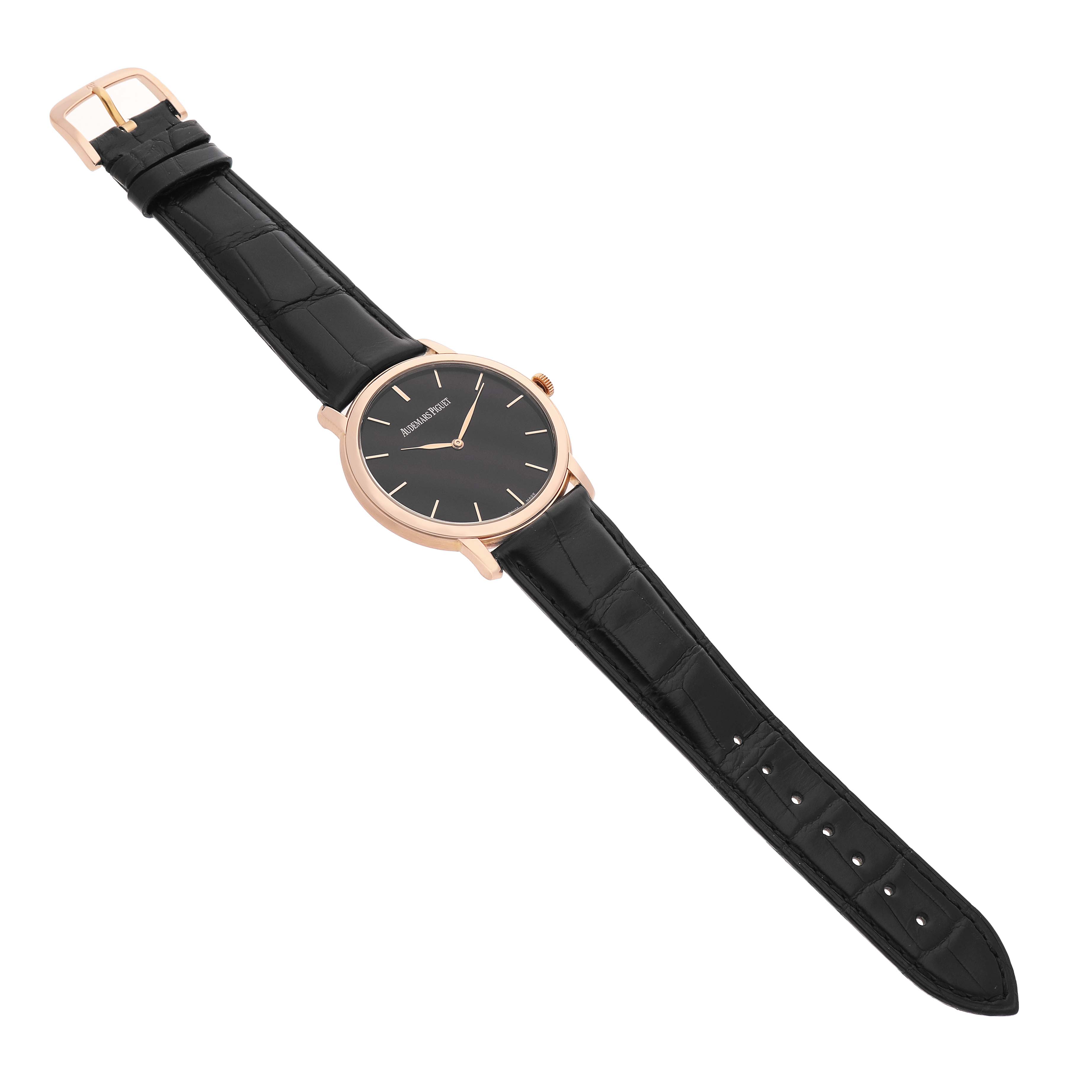 The image shows the Audemars Piguet Jules 15180OR Men's Rose Gold Black Dial watch at an angled top view, highlighting the black dial, rose gold case, and leather strap.