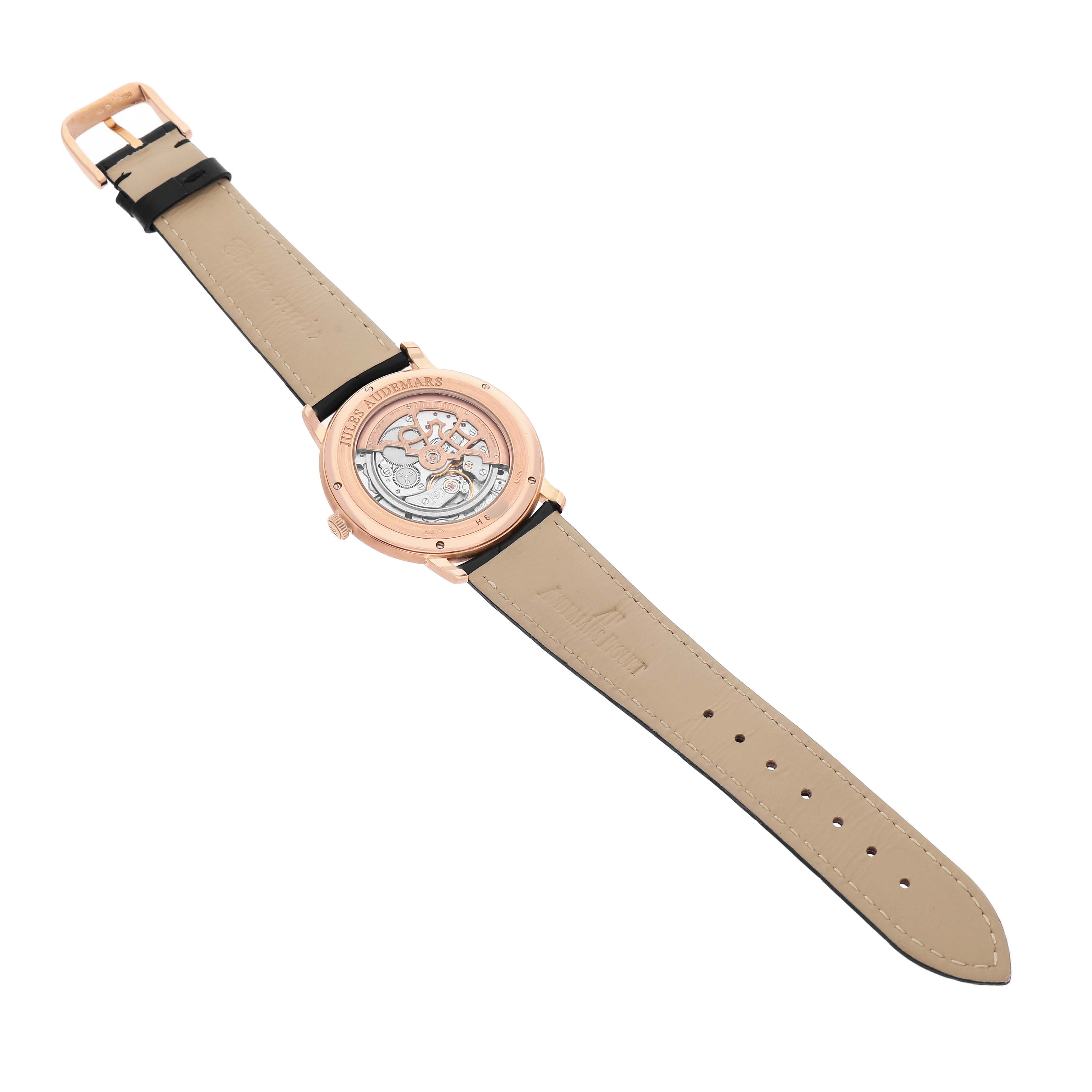 The image shows the back view of the Audemars Piguet Jules 15180OR Men's Rose Gold Black Dial model, highlighting the exposed movement and leather strap.
