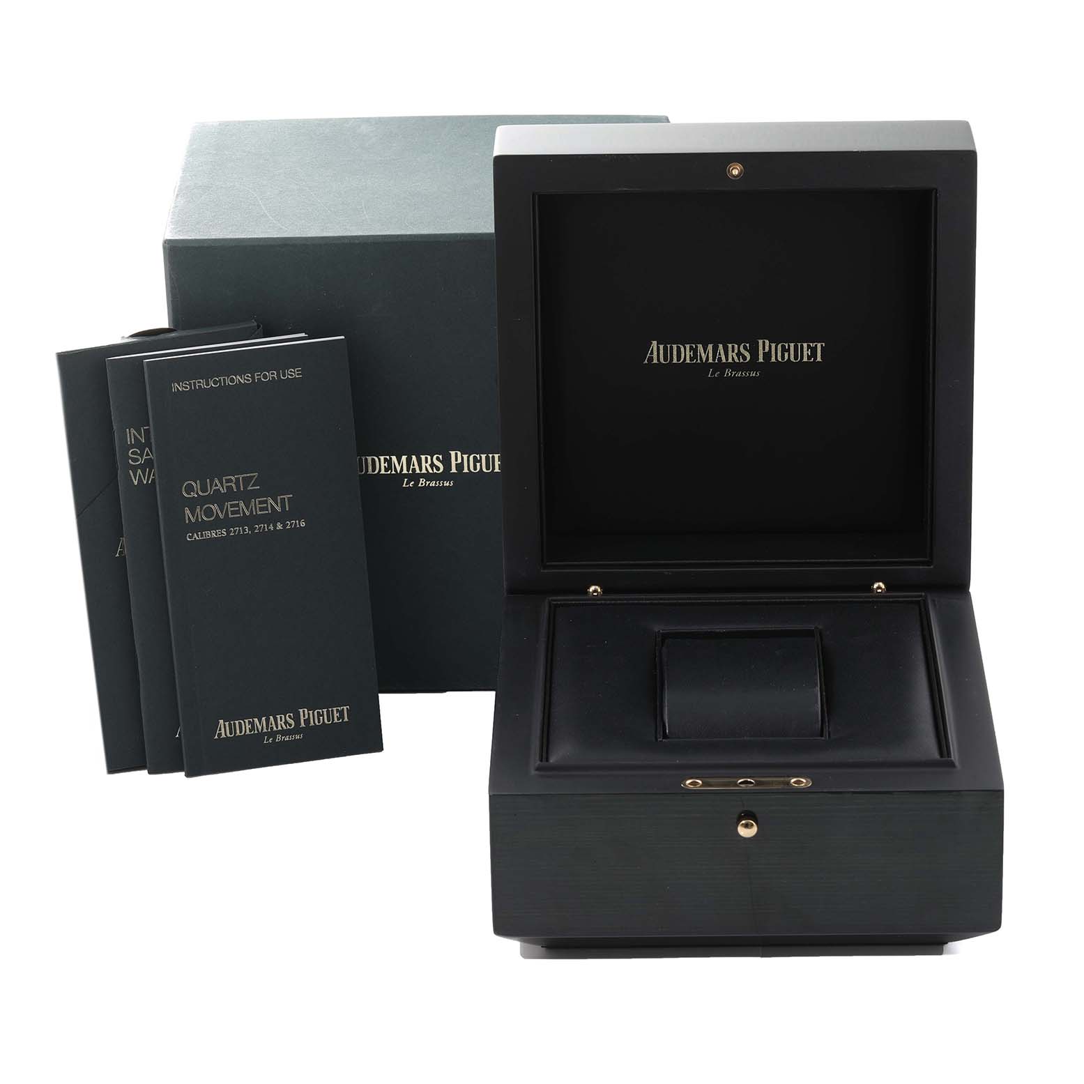 The image shows the open box and instruction booklets for the Jules model by Audemars Piguet.