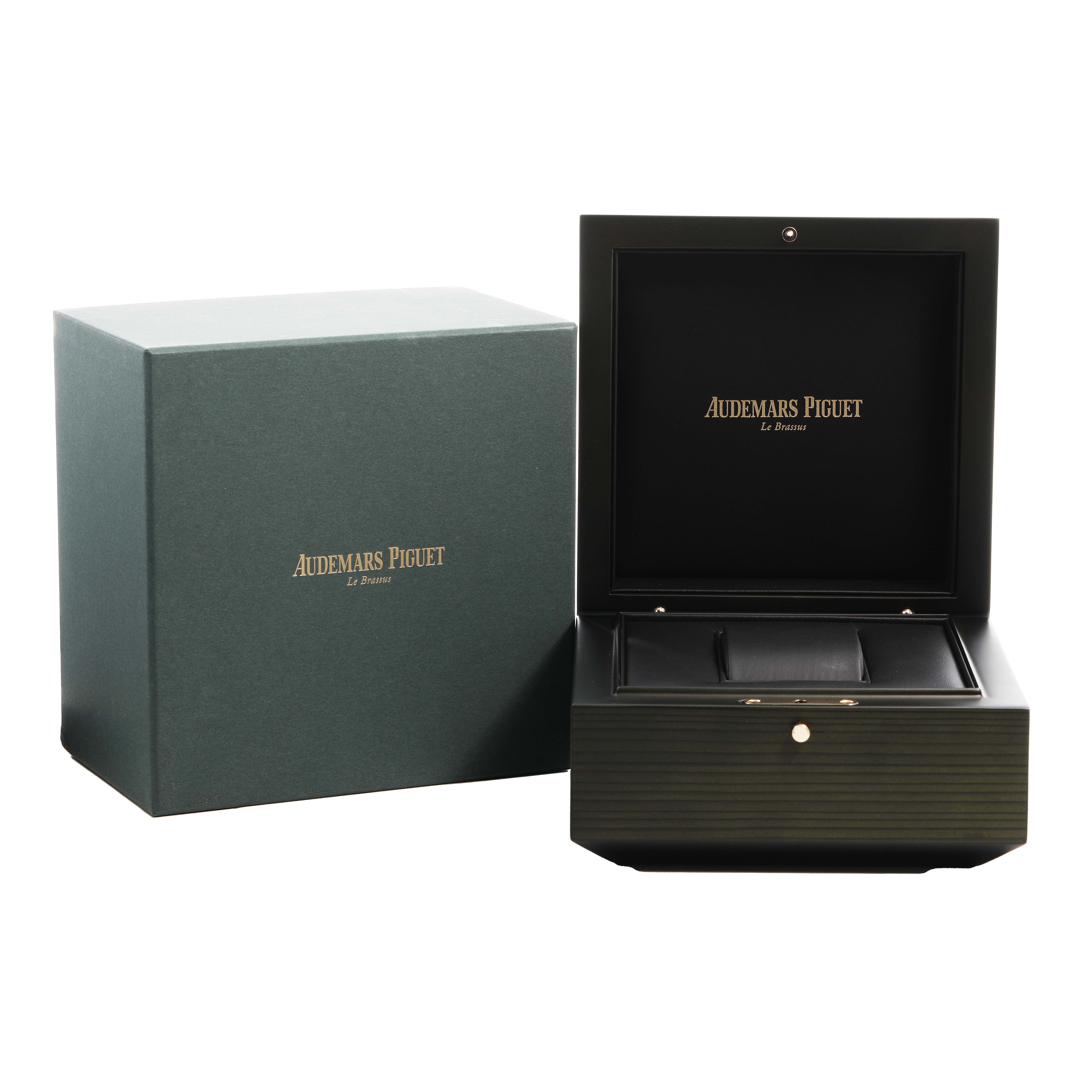 The image shows the open box and outer packaging for an Audemars Piguet Royal Oak Offshore 26036SK.ZZ.D002CA.01 Women's Stainless Steel Black Dial watch.