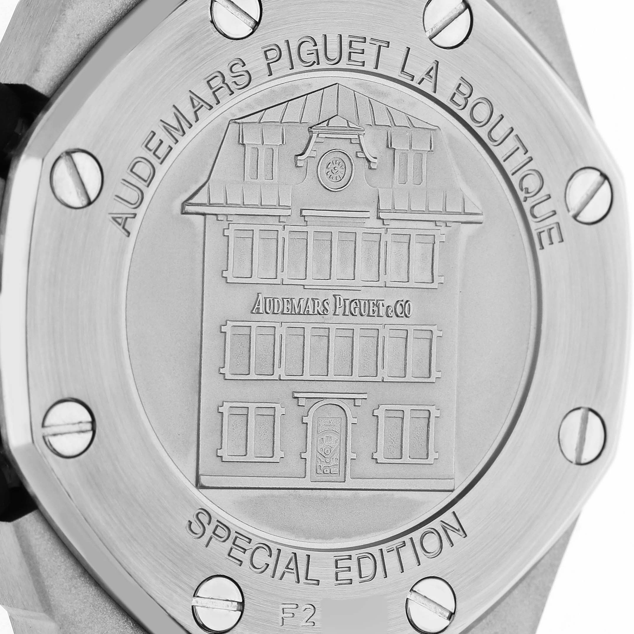 The image shows the back case of an Audemars Piguet Royal Oak Offshore 26036SK.ZZ.D002CA.01 Women's Stainless Steel Black Dial, featuring engravings and screws.
