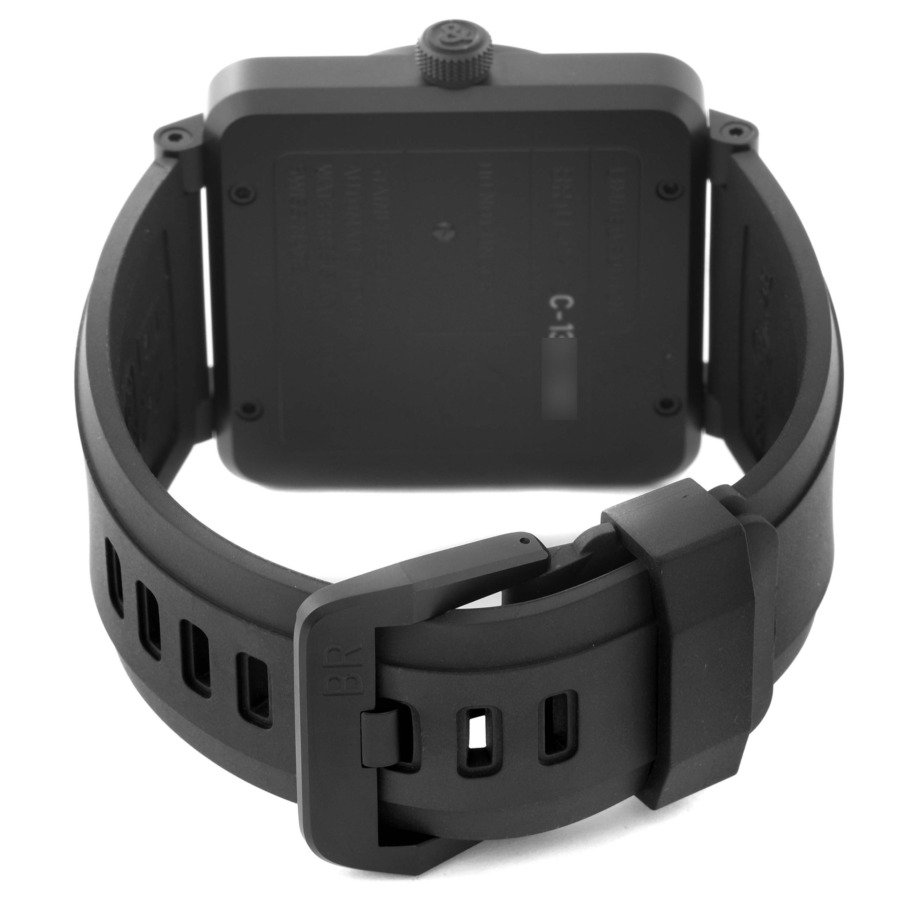 The image shows the back of the Bell & Ross Instruments BR01-92-S Men's Stainless Steel Black Dial BR01-92-S Men's Stainless Steel Black Dial model watch, focusing on its square case and black rubber strap with buckle.