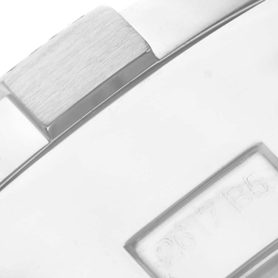 This close-up image shows the side view of a Breitling Avenger A13381 Men's Stainless Steel Mother of Pearl Dial A13381 Men's Stainless Steel Mother of Pearl Dial watch, highlighting the brushed metal finish and a portion of its engravings.