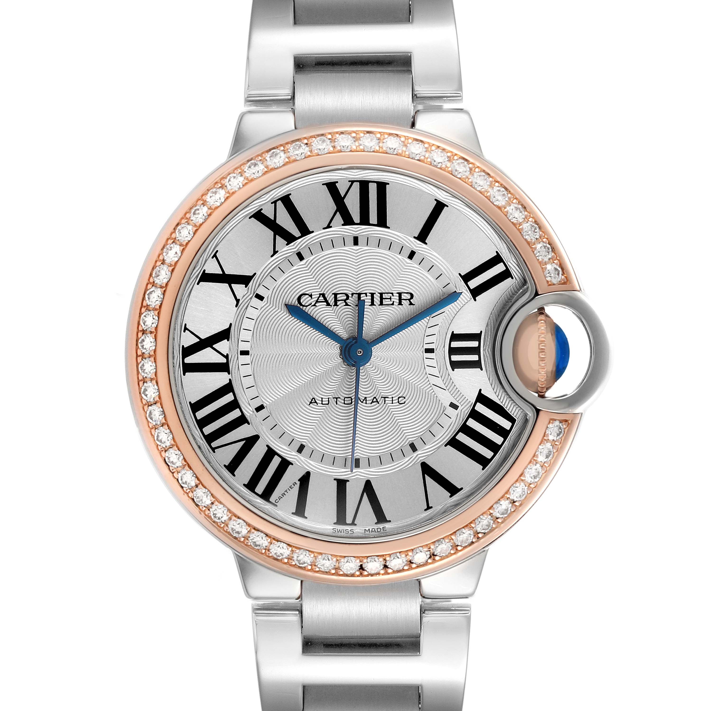 The Cartier Ballon Bleu WE902080 Women's Stainless Steel Silver Dial watch is shown from a front angle, highlighting its dial, diamond bezel, and unique crown design.