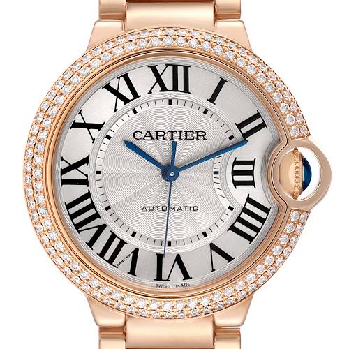The Cartier Ballon Bleu WE9005Z3 Women's Rose Gold Silver Dial watch is shown from a frontal angle, displaying its face, diamond-studded bezel, and crown jewel.