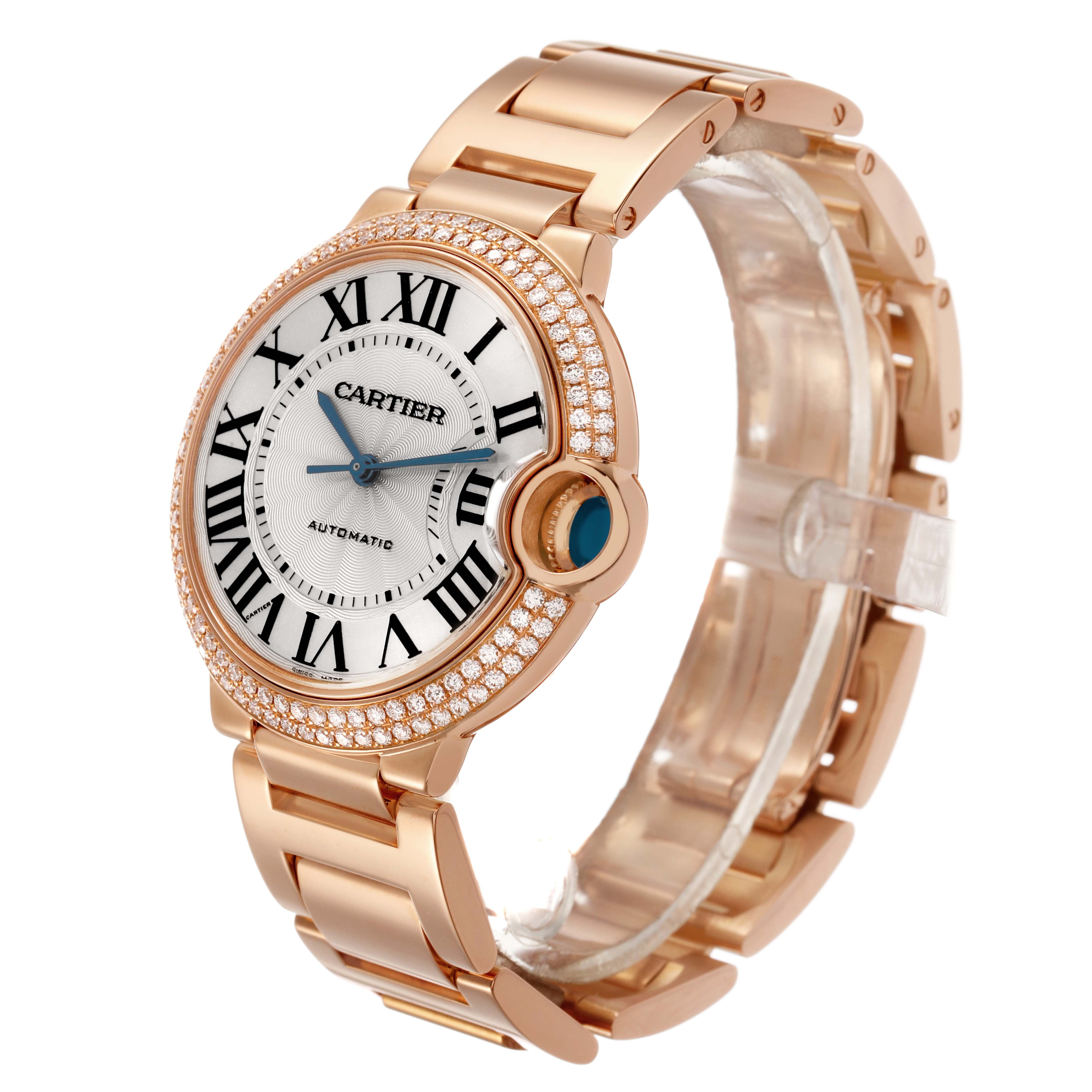 The Ballon Bleu by Cartier is shown at a slight angle, featuring a gold case, diamond bezel, crown, and link bracelet.